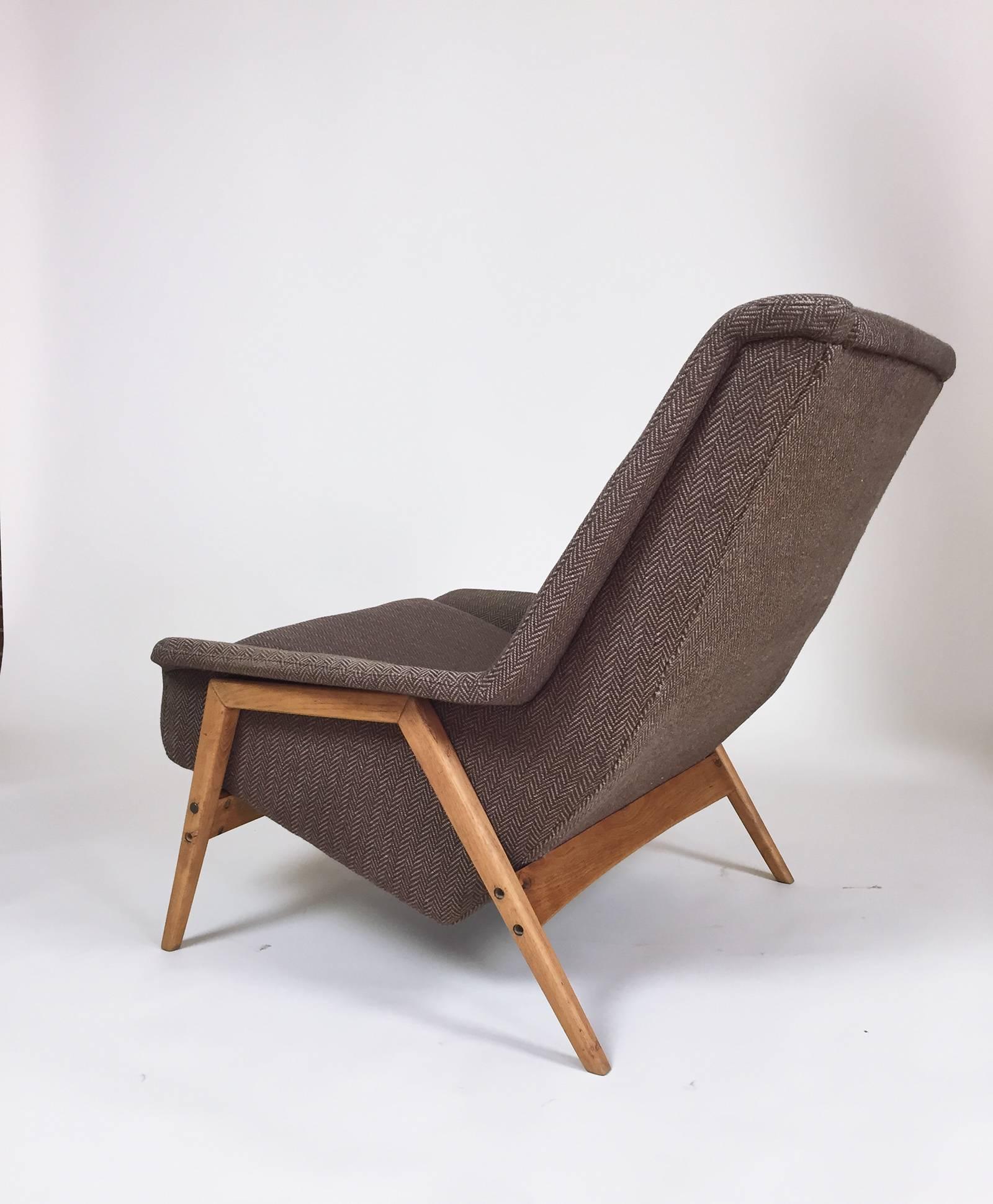 Vintage Scandinavian Modern Lounge Chair by Folke Ohlsson for DUX, 1960s. Deep and comfortable lounge chair in brown wool houndstooth upholstery.  Upholstered seat is in very good condition, though pillow could use a refresh. Oak base in great