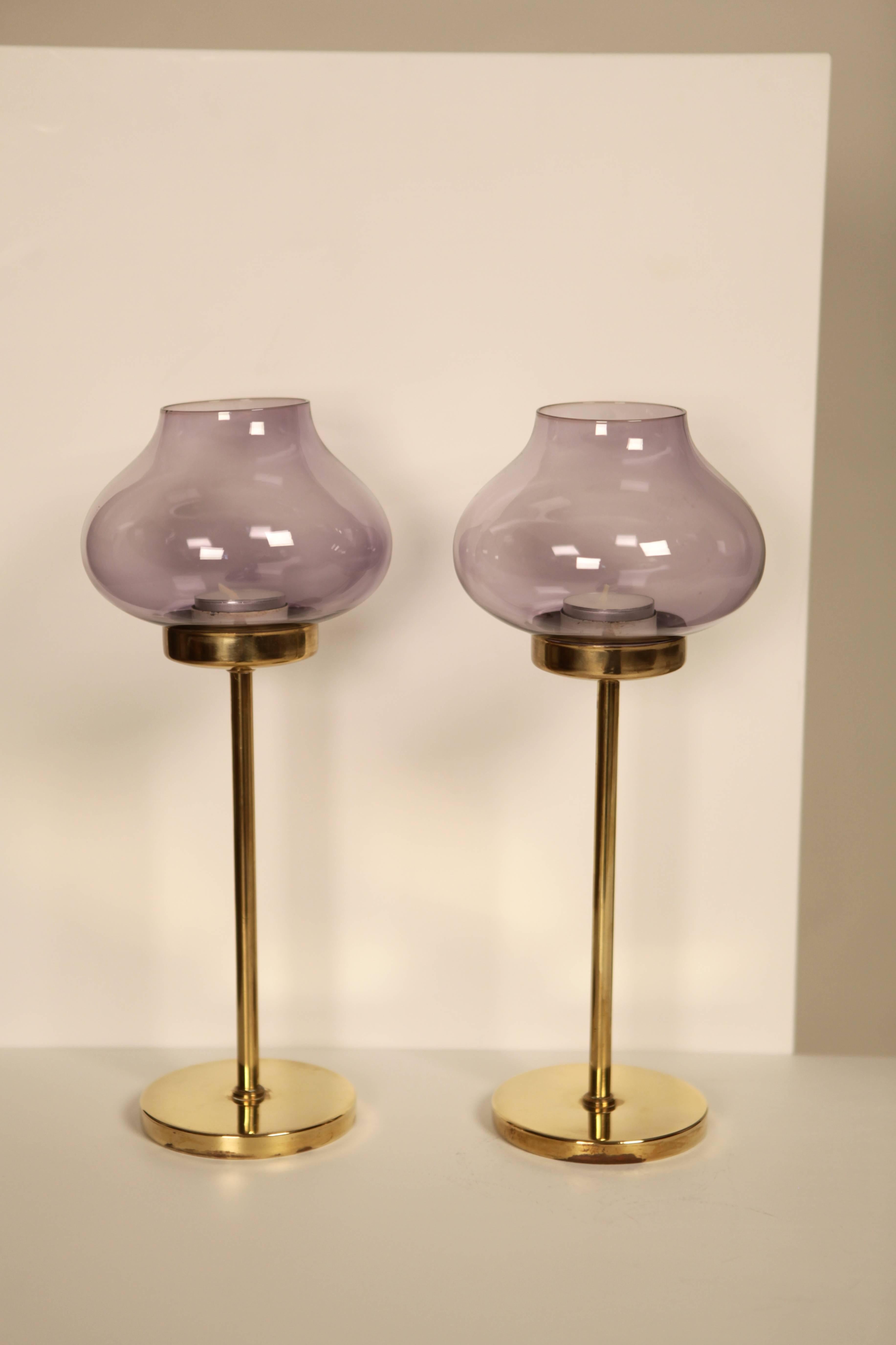 Hans-Agne Jakobsson
A pair of brass and light purple colored glass candlesticks,
Sweden, 1960s