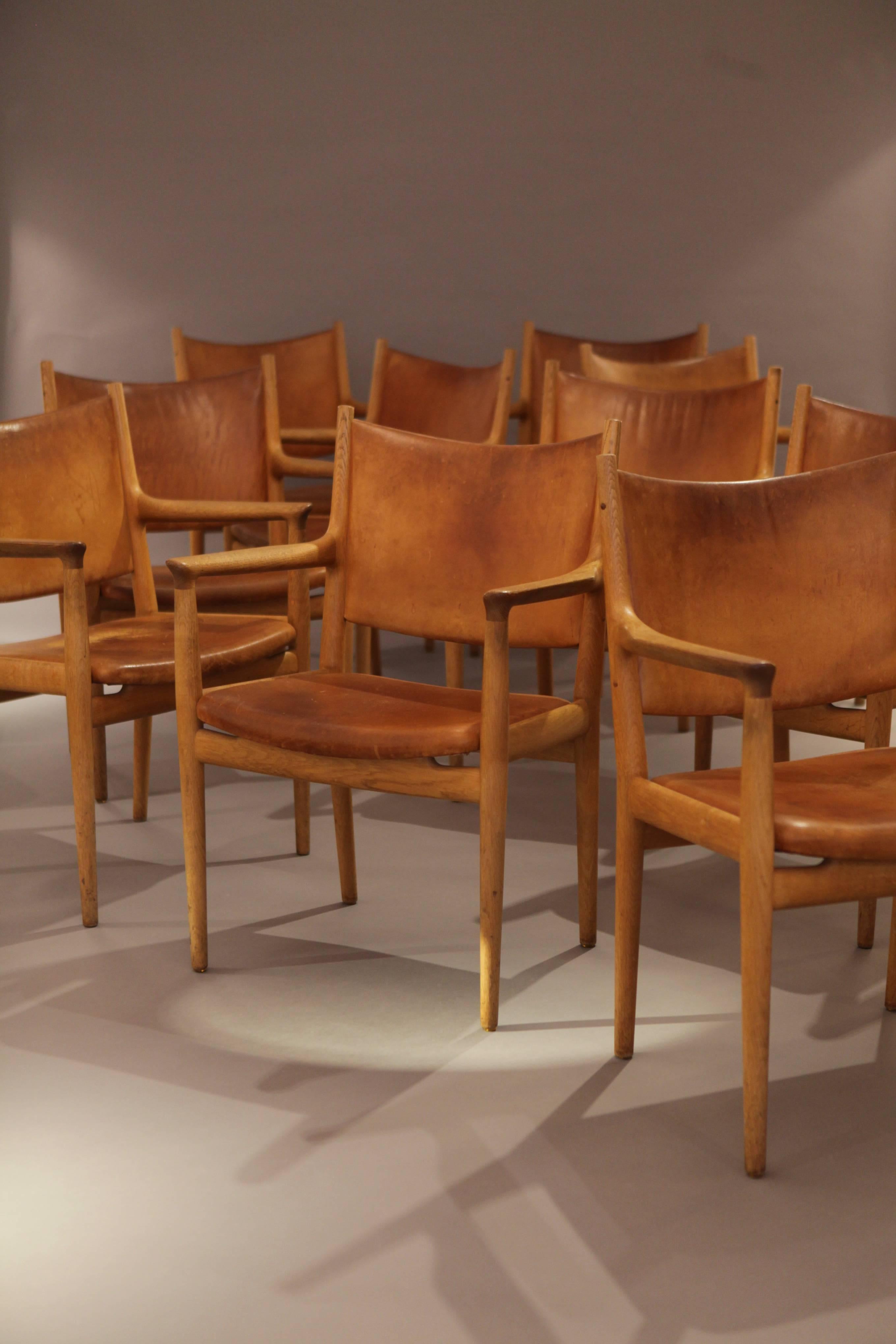 A set of ten rare and original Hans Wegner JH-713 Armchairs in original condition from 1960s, by Cabinetmaker Johannes Hansen, all signed with the original Manufacturers / Designers Metal Label.
Perfect vintage condition and patina to the old