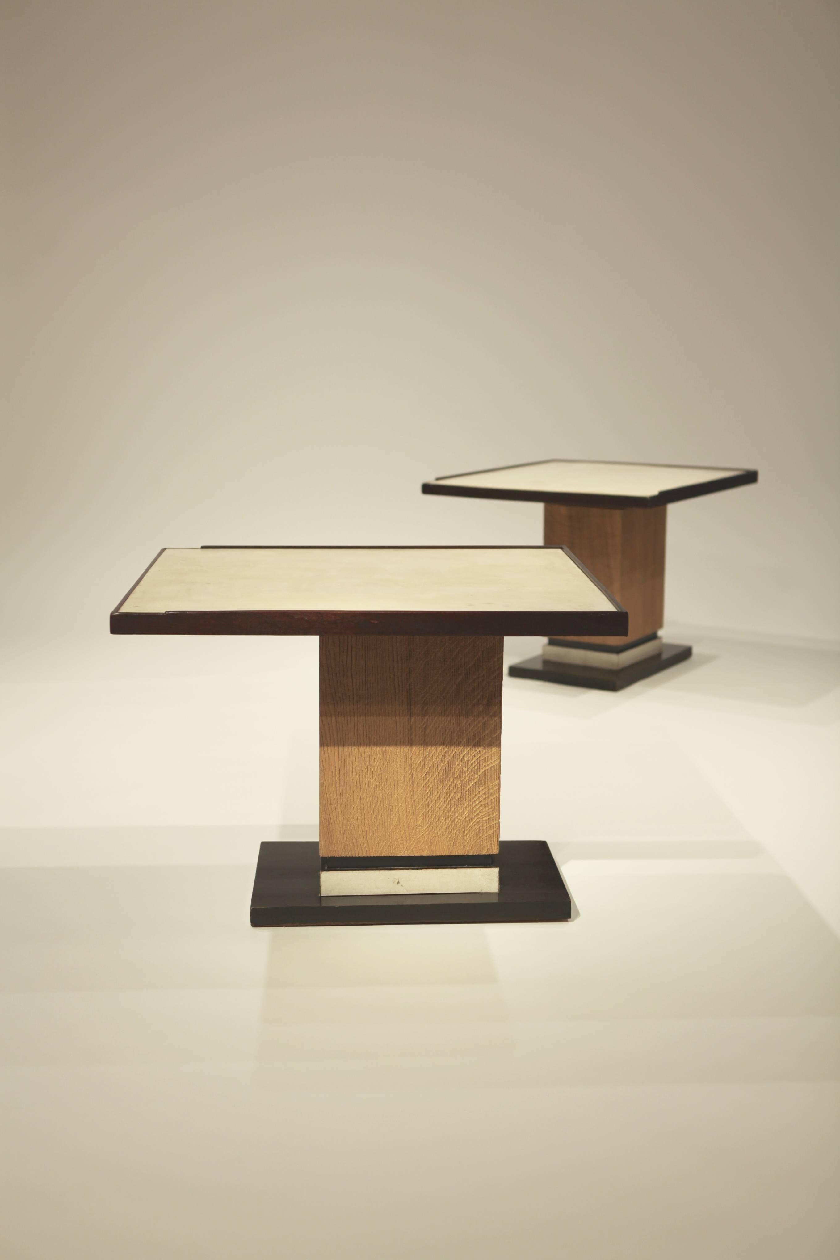 A pair of parchment and cerused oak side table in the style of
Dupré-Lafon.
 