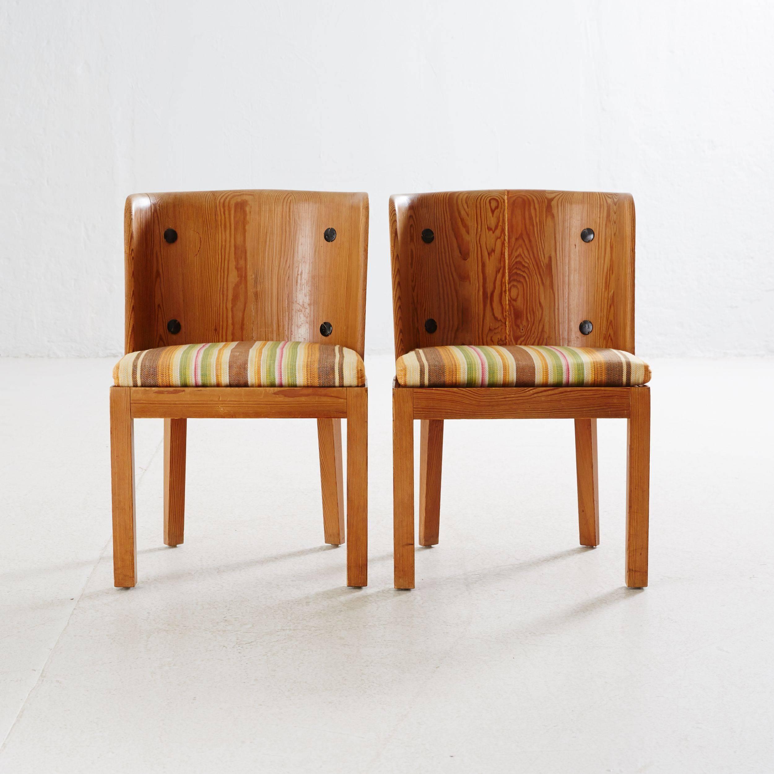 Axel Einar Hjorth.
A pair of Lovö armchairs, designed by Axel Einar Hjorth in 1932.
Manufactured by Nordiska Kompaniet in 1932.
Stained pinewood.
Original upholstery.
Iron rivets.