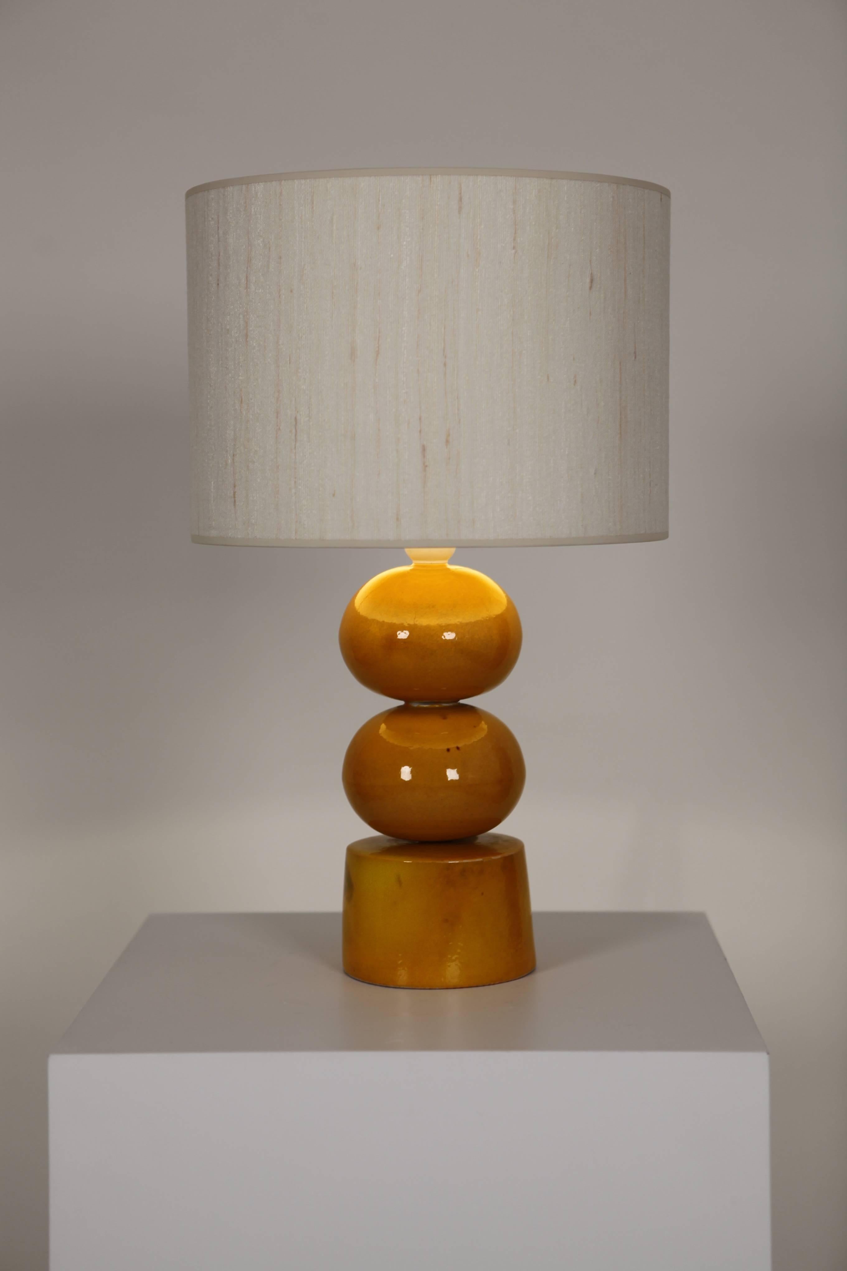 A Gustavsberg, 1970s glazed stoneware table lamp,
with a handmade silk shade,
Sweden.
   
