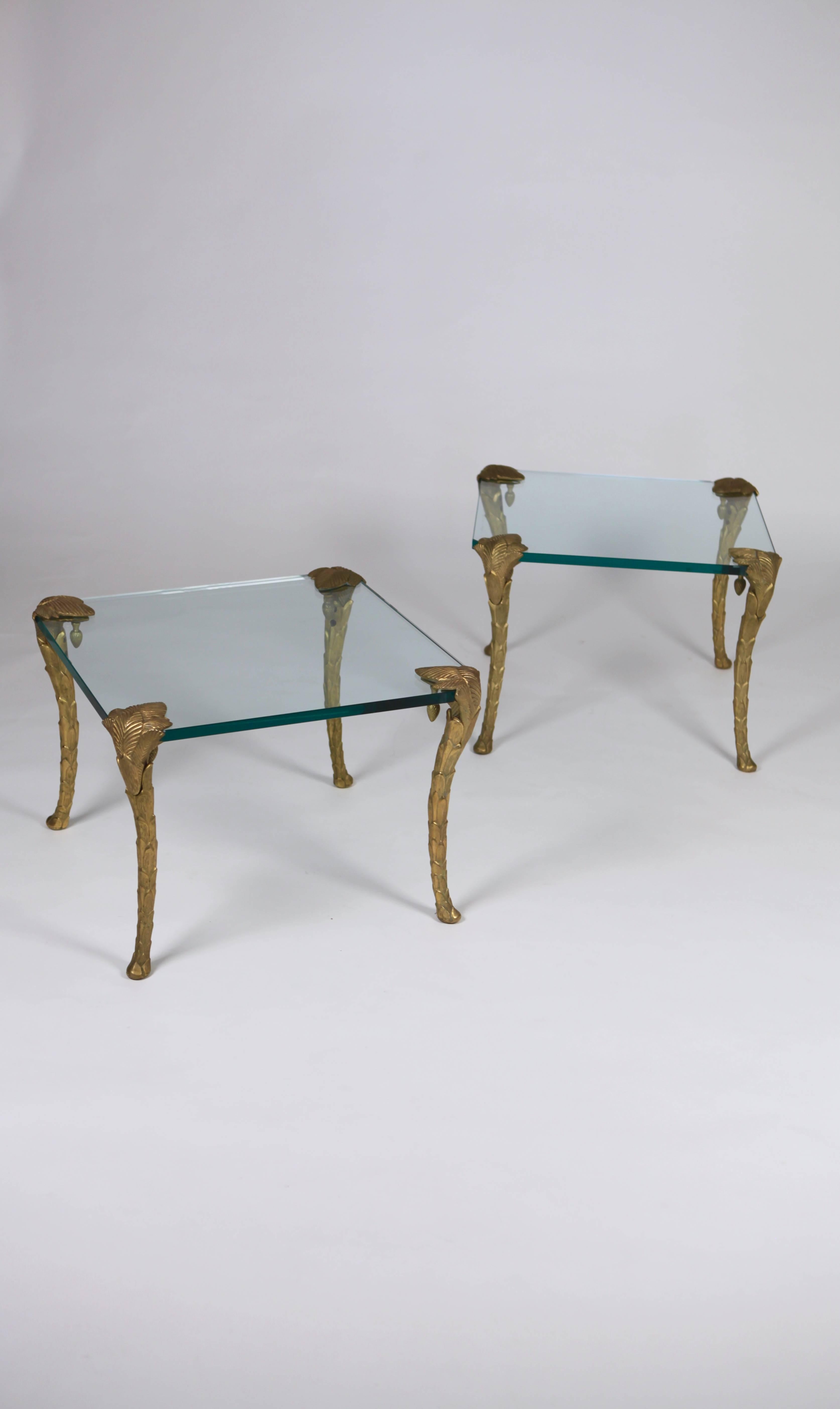 A pair of Maison Charles bronze and glass coffee tables,

France, 1960s.