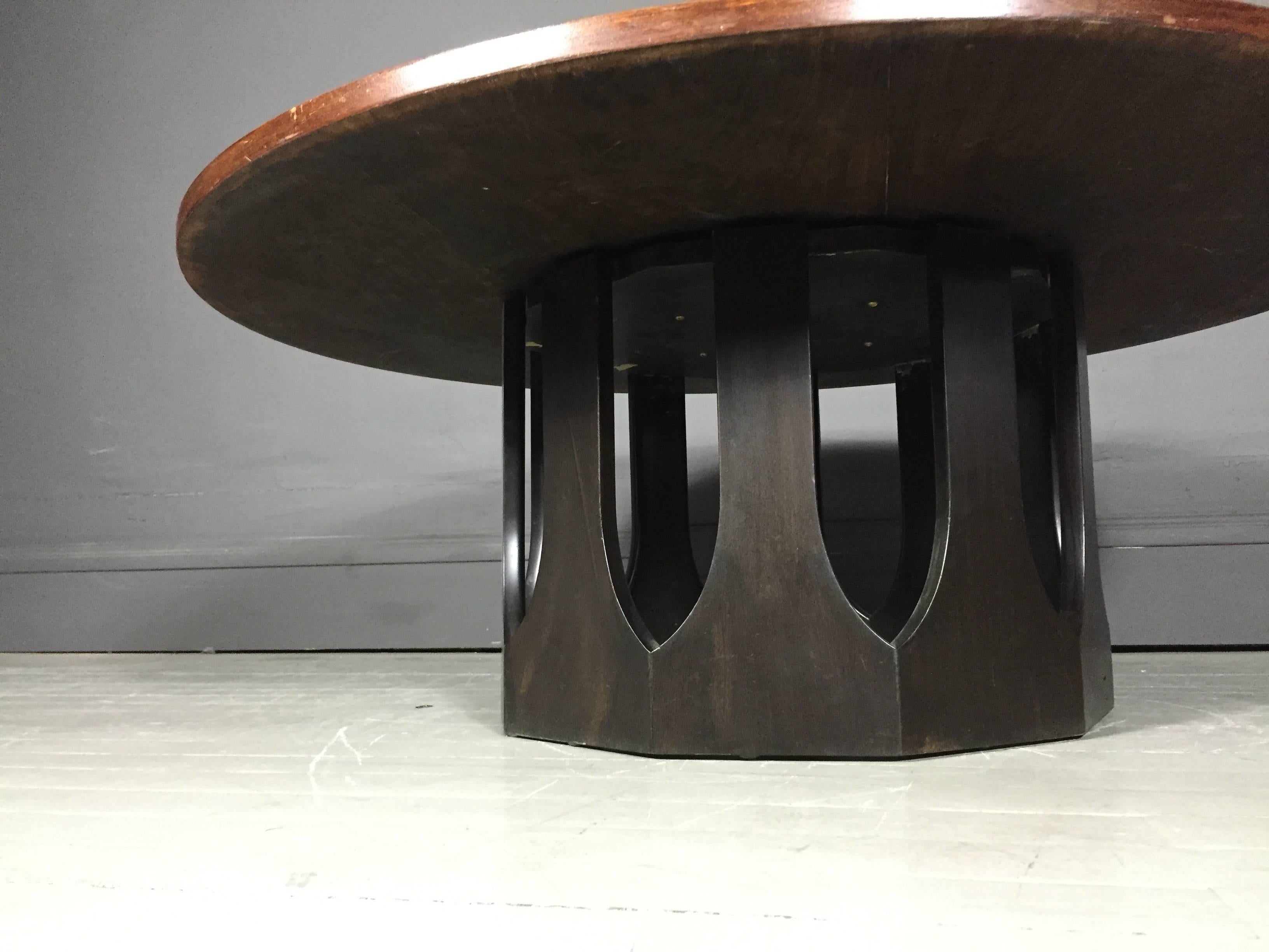 A classic American Modern designed coffee table with stained wood round 42
