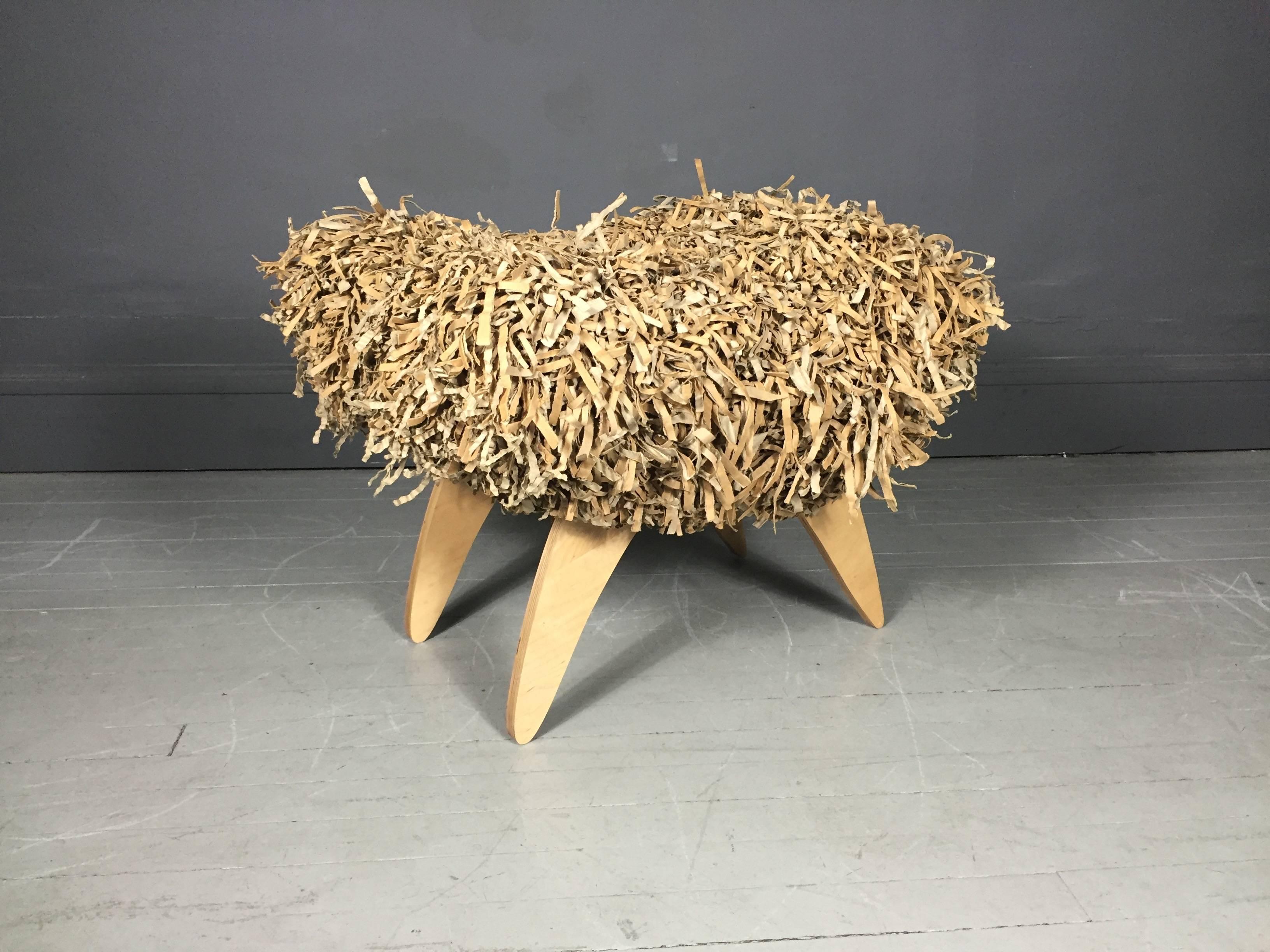 A one-of-a-kind prototype bench, curved top made from shredded cardboard, base in plywood, Joel Stearns - associate on the design team under Frank Gehry in the late 1980s. Joel started New City Furniture in Venice California and is known for