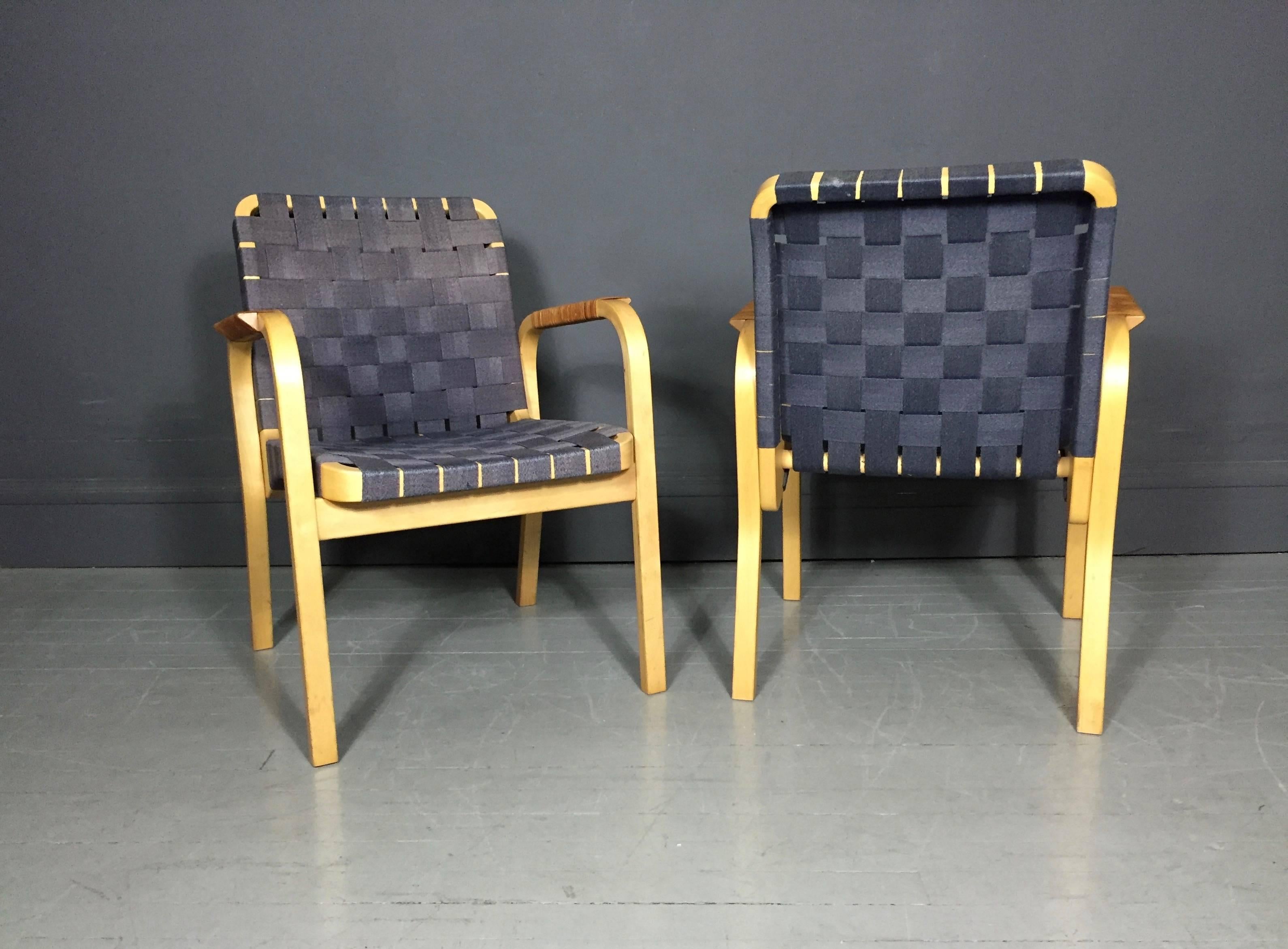 One of my favorite webbing colors in steel blue for the Alvar Aalto Model NV 45 armchair for Artek, designed in 1947. Laminated birch frame and exquisite organic cane wrapped arms, Finland, 20th century production. Two available, sold individually.