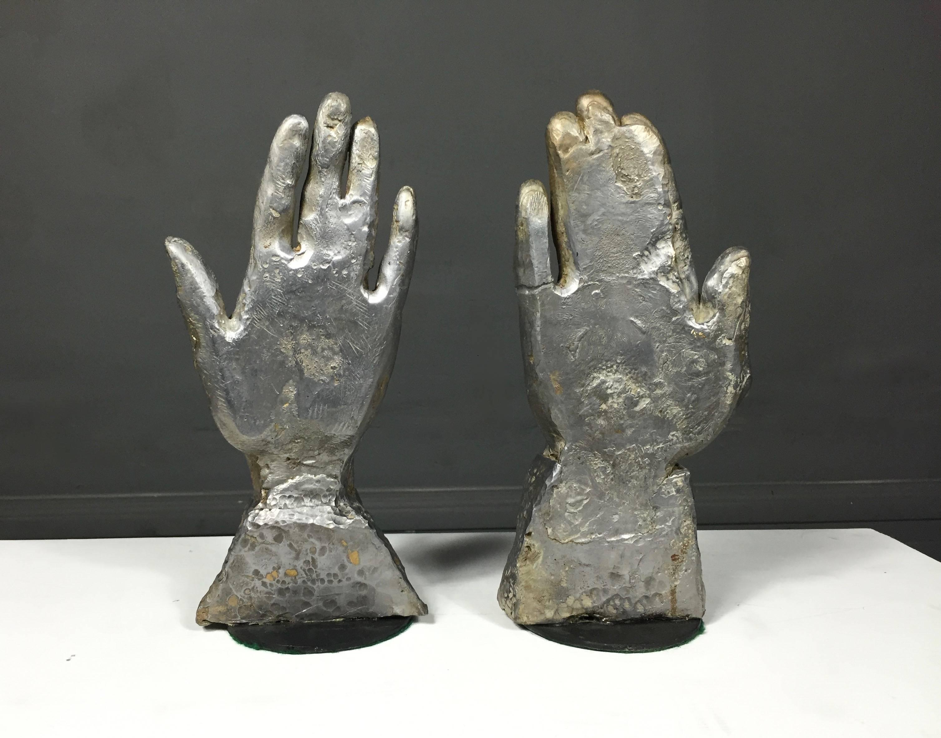 A very interesting pair of sculptures in solid lead of a male and female hand with a relative cuff base. Both have metal disk for stability - likely a later add, 1970s. Unmarked.