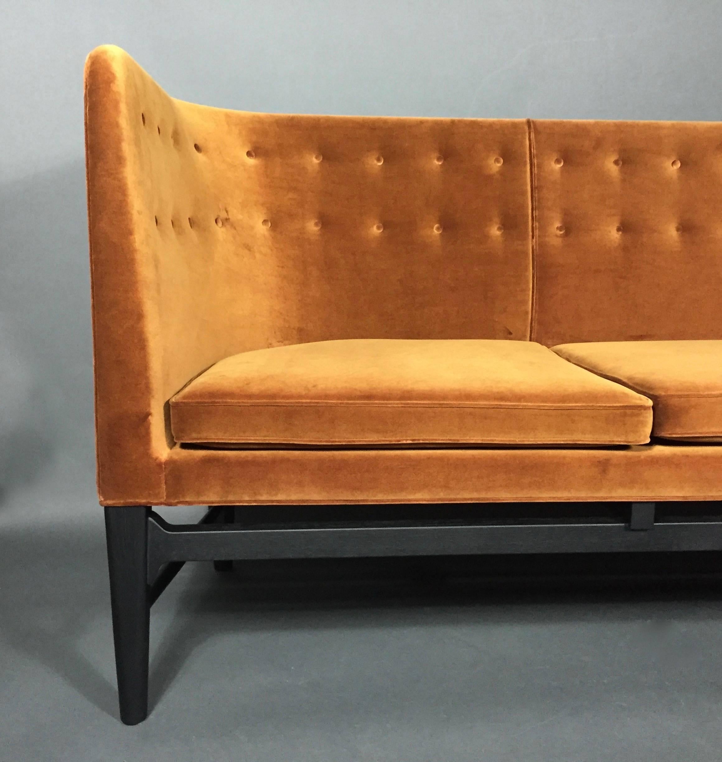 The gorgeous modern sofa was designed in 1939 as part of an architecture project for a city hall in Søllerød, Denmark. Both Arne Jacobsen and Flemming Lassen designed every aspect of the project from building to furniture - with the original sofa