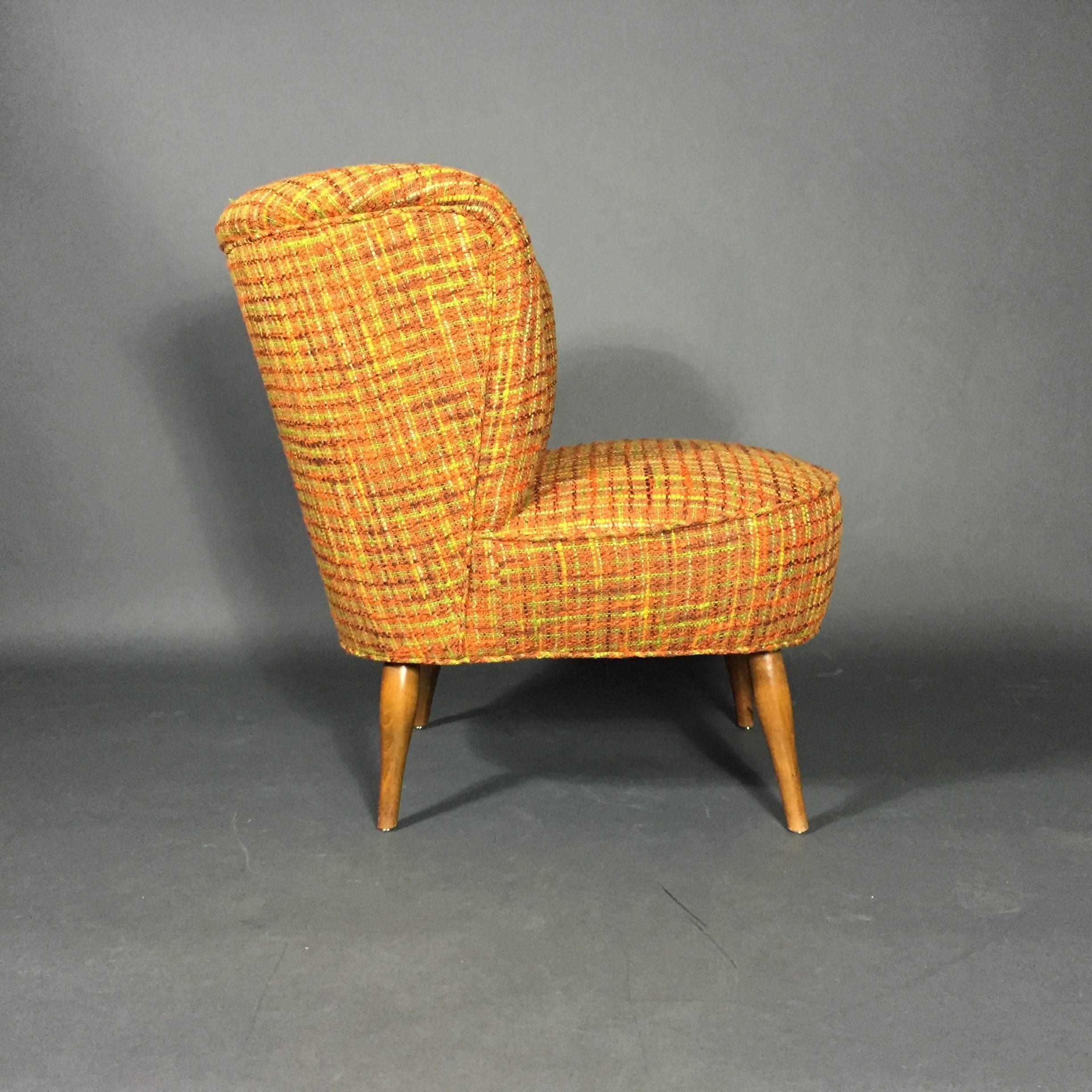 A very sweet lounge chair in the style of Viggo Boesen from the 1950s, likely Danish with a recent upholstery using a wonderful vintage orange bouclé fabric. Perfection.
