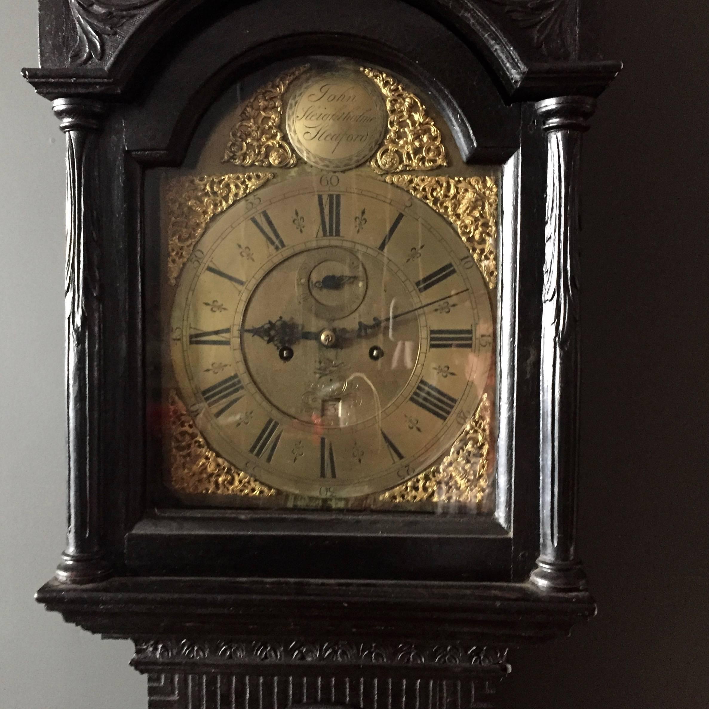 Queen Anne Mid-18th Century English Black Polished Ornately Carved Tall Case Clock