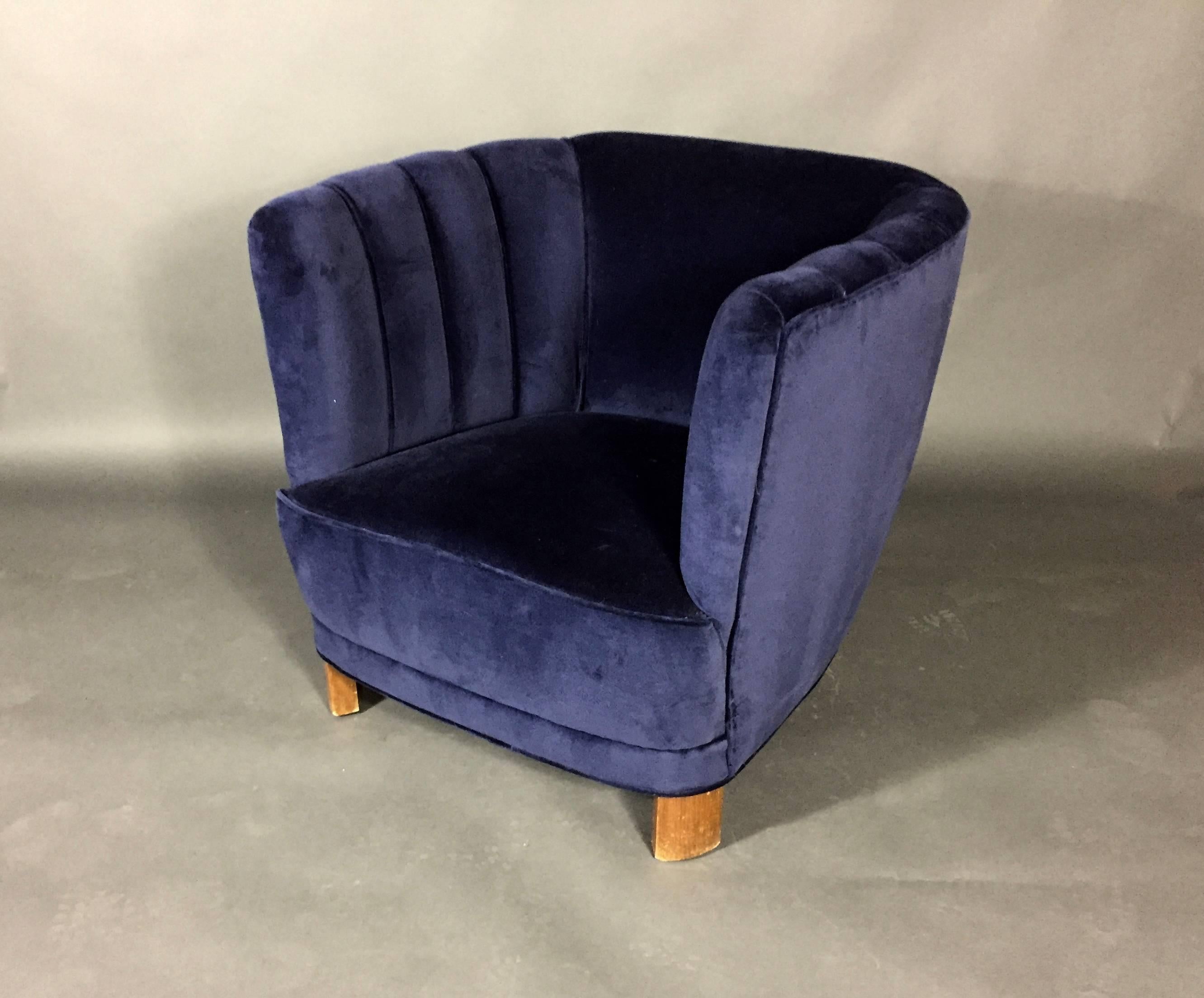 Gorgeous Danish club chair from late 1930s-early1940s recently updated with Moode NYC navy velvet. Curved front legs typical of the period and original back upholstered channels.