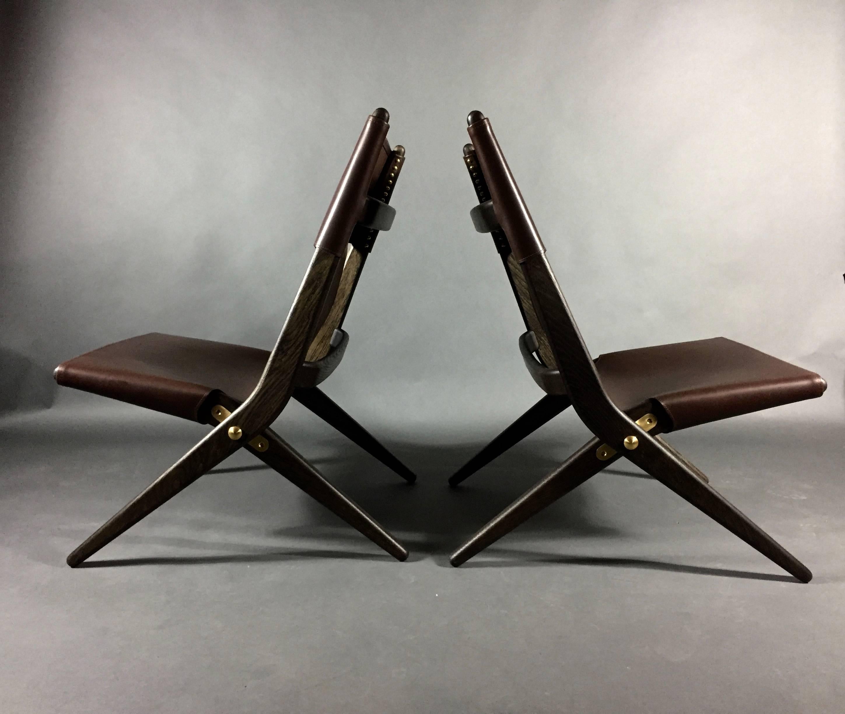 Designed by visionary architect Mogens Lassen for The Copenhagen Cabinetmakers’ Guild Competition in 1955 - and inspired by the Bauhaus era. Originally produced by master joiner A.J. Iverson, Denmark. This recently manufactured folding chair is made