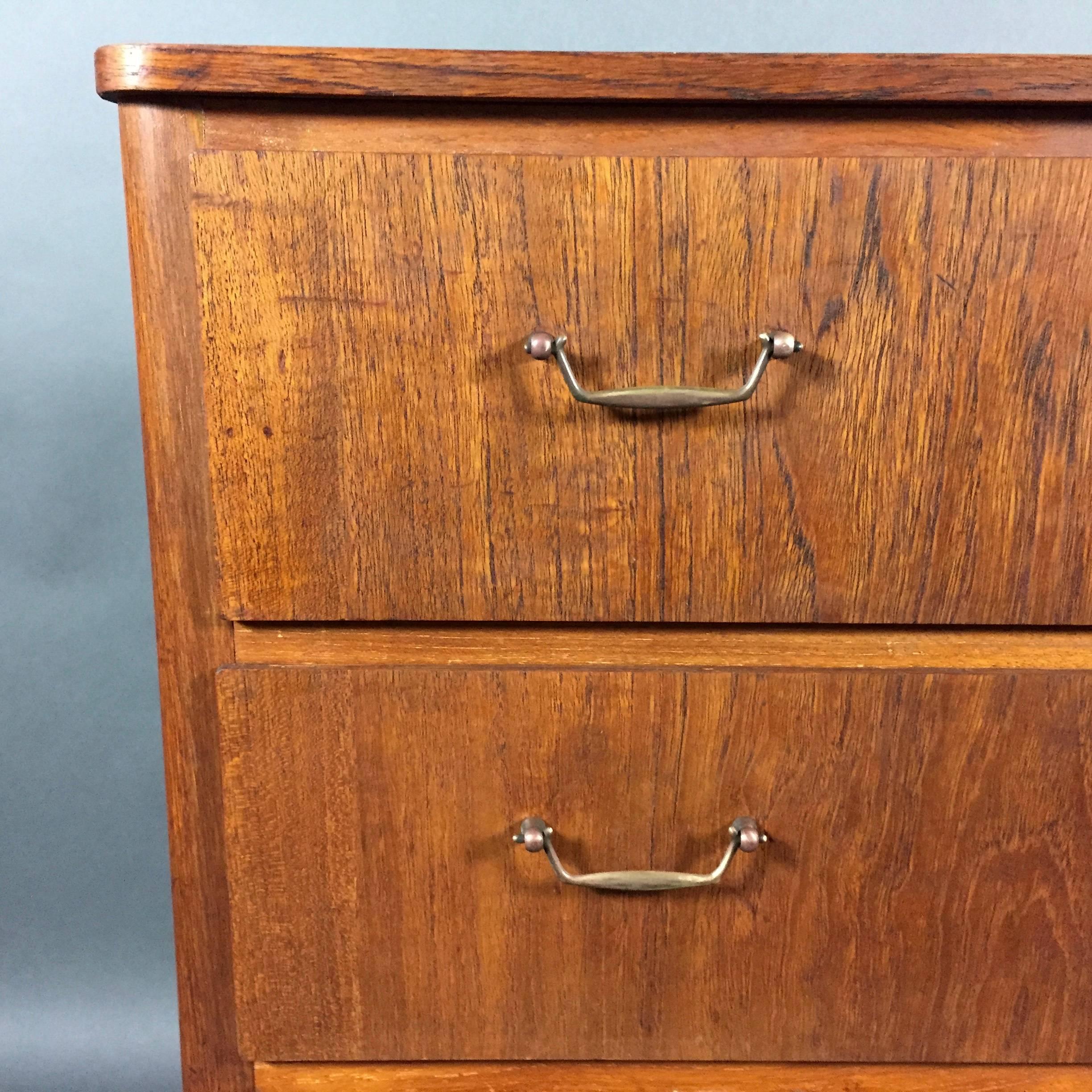 A very sweet four-drawer dressing cabinet veneered in a light wood with original brass drawer pulls and center locks. Likely Swedish, circa 1950s. No key.