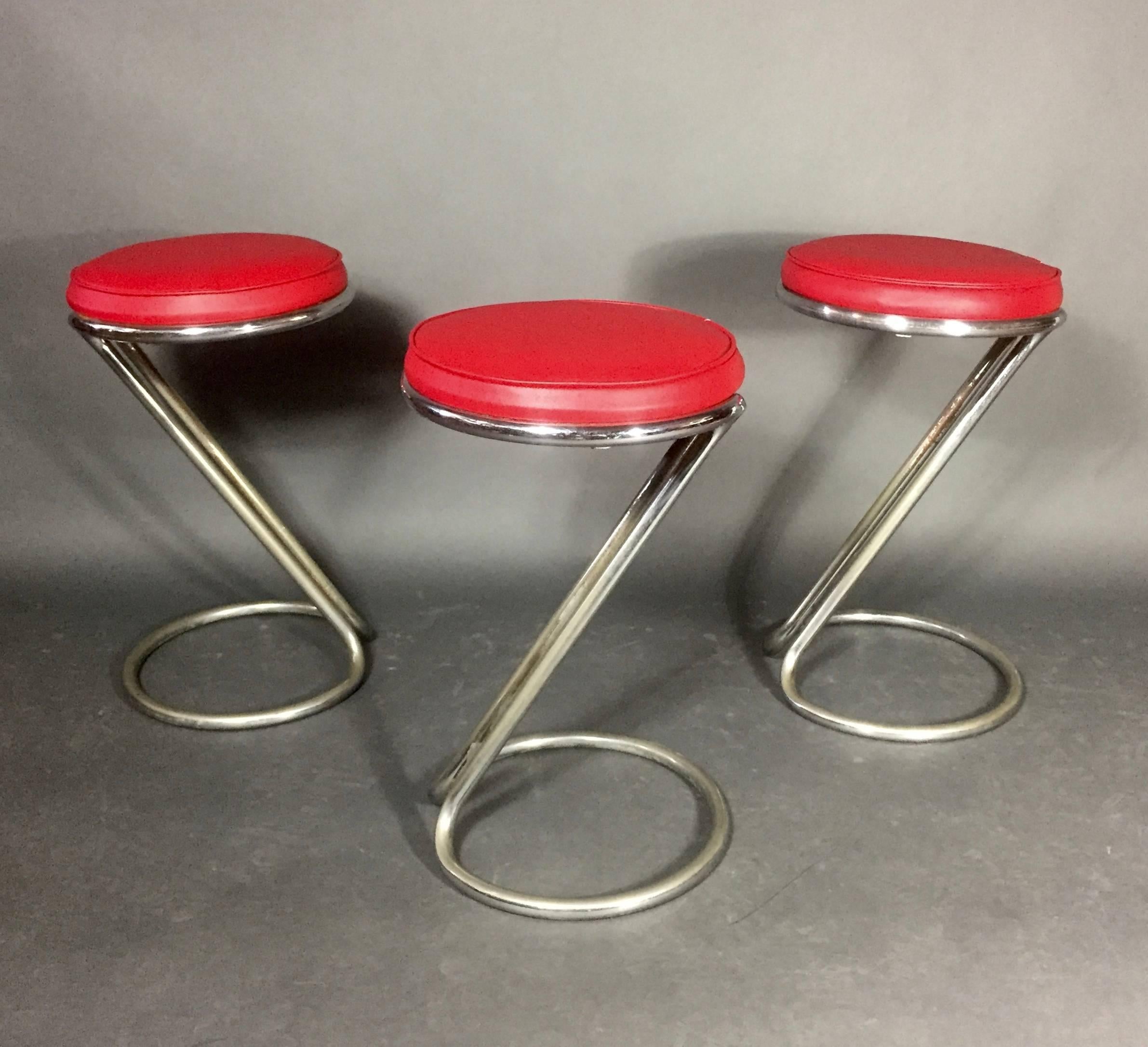 Chic and modern set of three vintage Z-stools by Gilbert Rohde - classic angled chrome-plated steel base with new vinyl seating, for Troy Sunshade, USA, 1930s. Some loss to chrome plating overall.  ONLY TWO REMAINING>