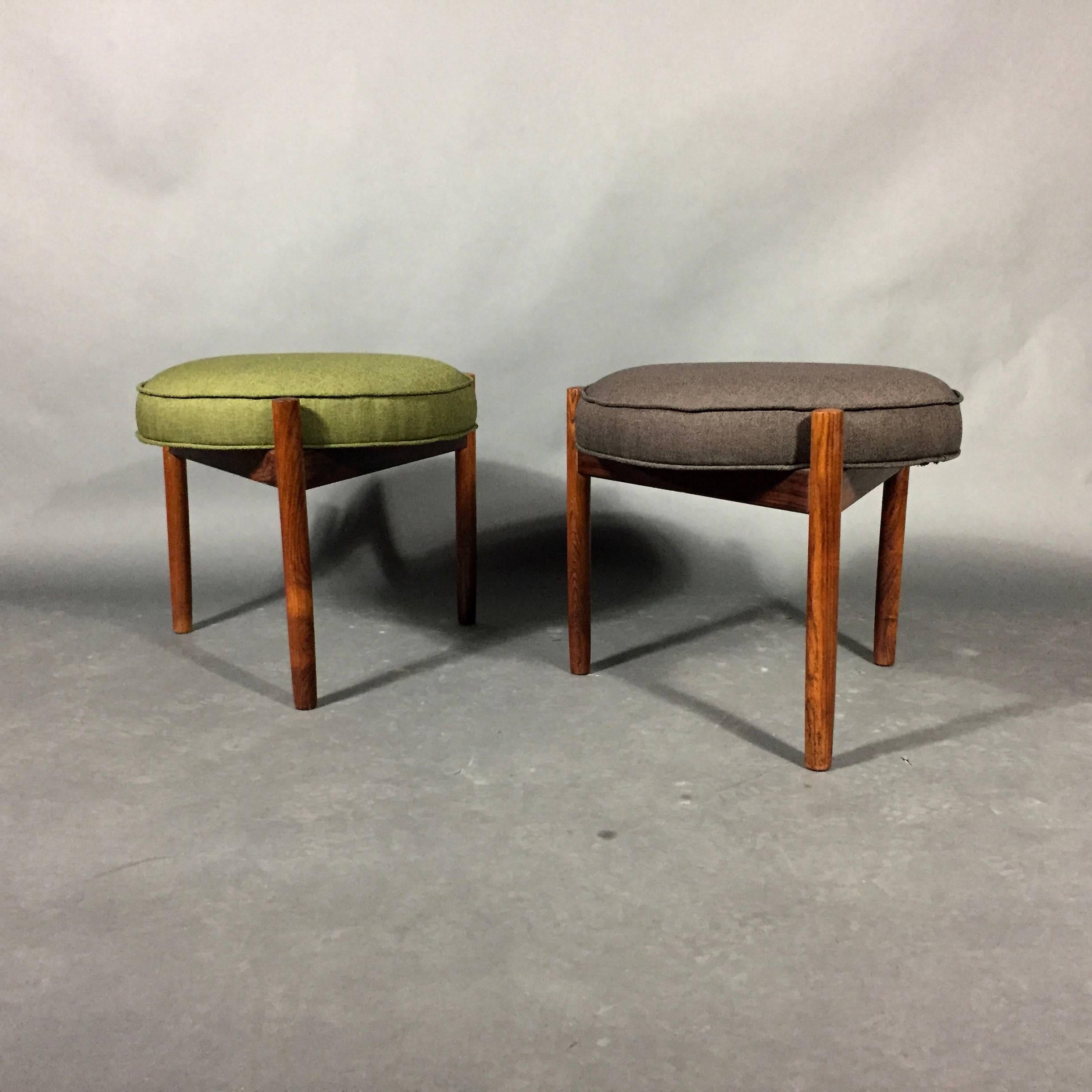 This gorgeous Scandinavian modern rosewood pair of three-leg stools by Spøttrup Møbelfabrik are recently updated with a chic Danish fabric that perfectly captures the era, 1960s.