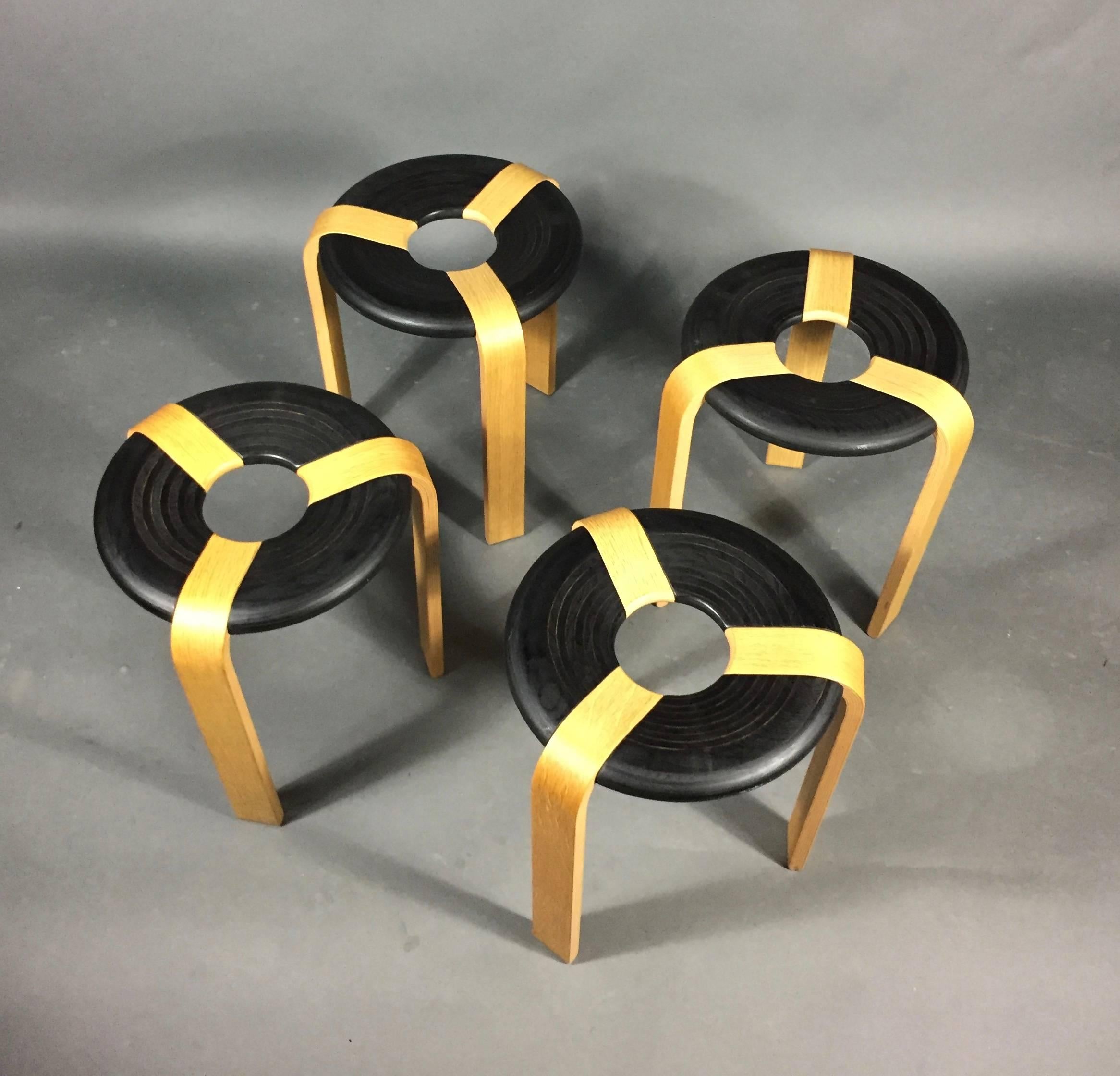Set of four Classic stools in lacquered plywood and laminated beech by Rud Thygesen and Johnny Sorensen for Magnus Olesen, Denmark designed 1971. Note that studio lights make the leg finish brighter and more yellow than is actual. All stamped at