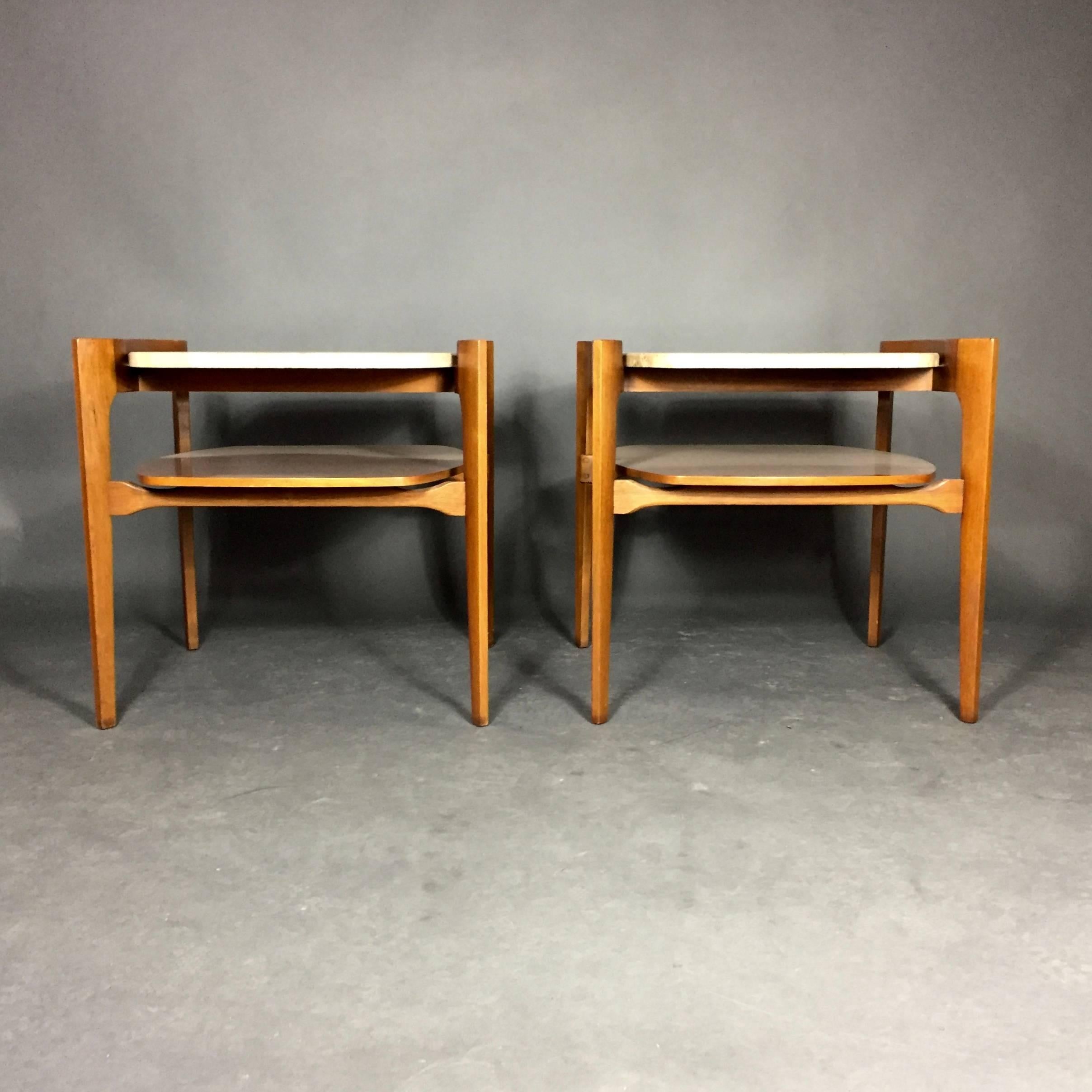 A beautifully balance pair of end tables with shaped Italian travertine tops over curved walnut frames and under shelf. Beautiful condition. Top not attached and supported perfectly onto frame. Marble tops marked Italy and also by make Walker