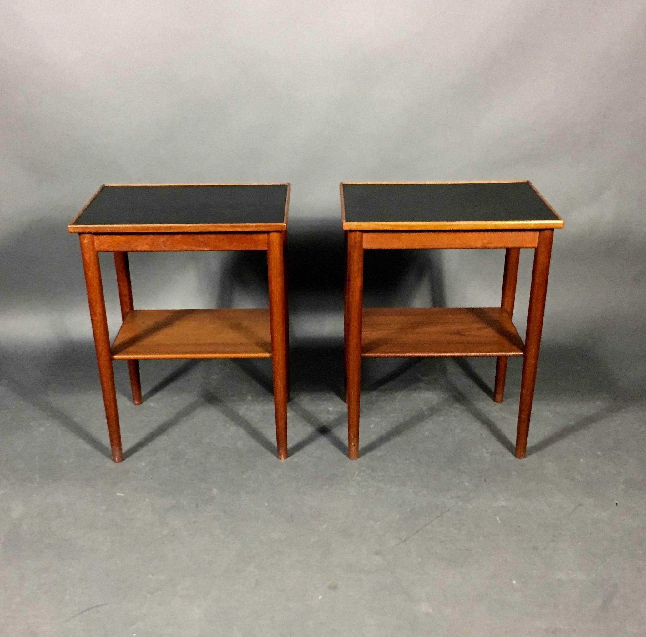 Danish furniture design: Stylish pair of side tables with frame of teak, top with black formica. No marks.
