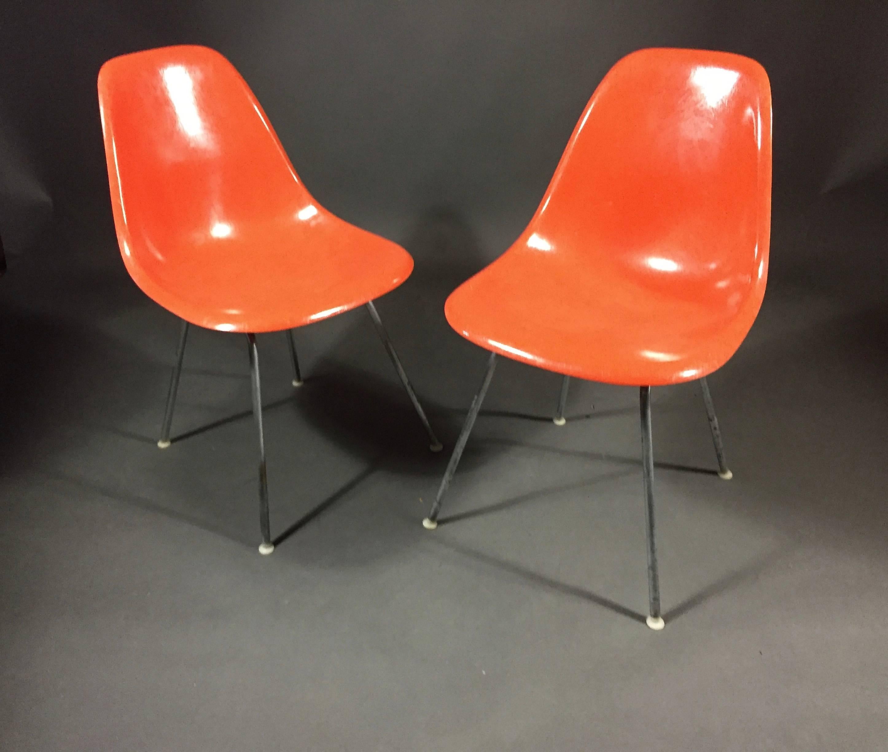 All original H base and orange fiberglass shell chairs by Charles and Ray Eames for Herman Miller. Late 1960s or early 1970s. Eight available in very good vintage condition with normal wear to metal legs all original plastic feet intact, shock