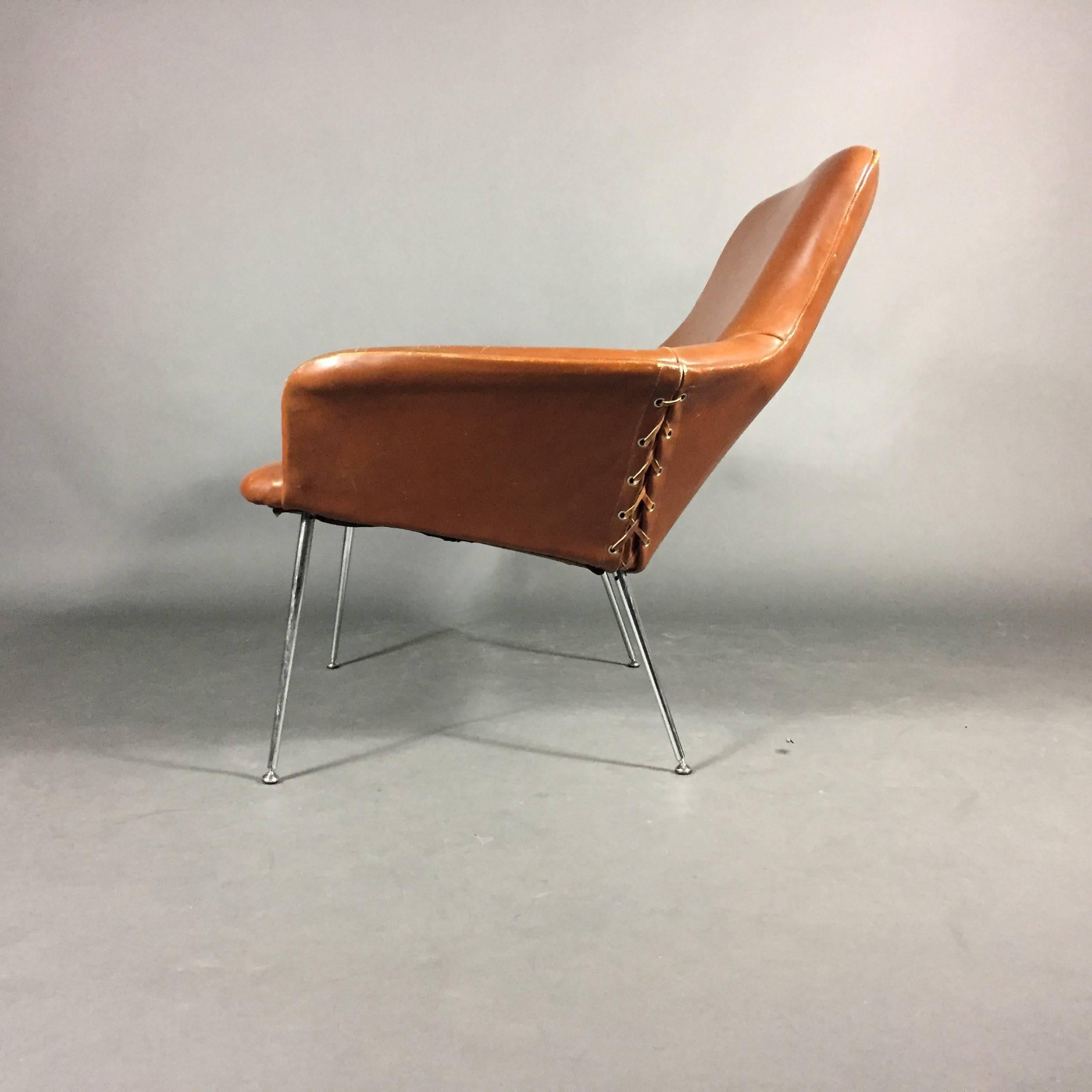 A very sexy and rare example of chair design by Poul Nørreklit with tightly stitched leather over chromed steel frame. Wide-set seat with side lacing is exceptional. Designed 1964 for A. Leidersdorffsen A/S, Denmark.