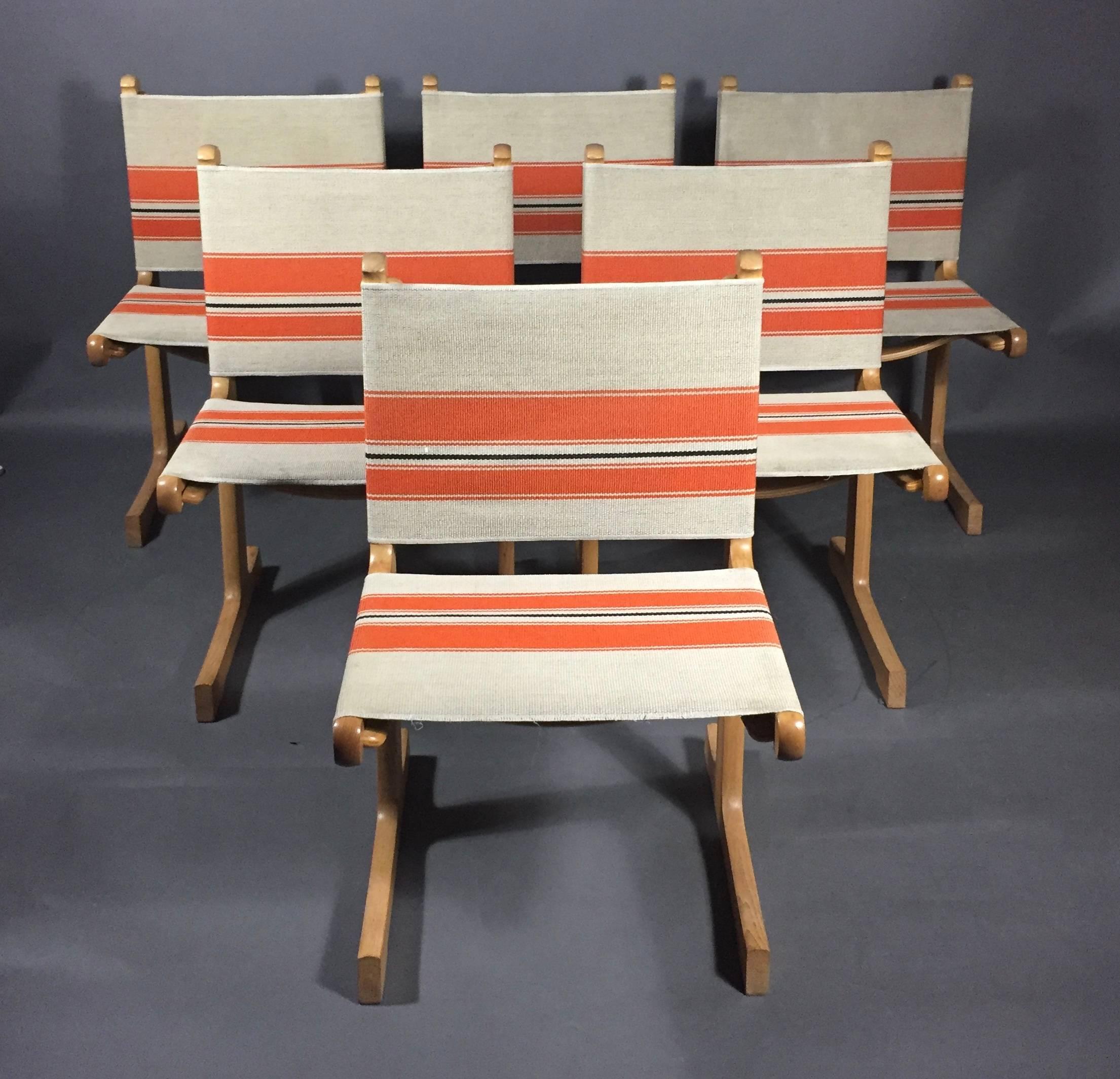 A Classic in Mid-Century Scandinavian design by the husband and wife architect team of Ditte and Adrian Heath. Solid ashwood frames with original orange stripe canvas in excellent condition. Manufactured by France & Søn with plaquette to underside