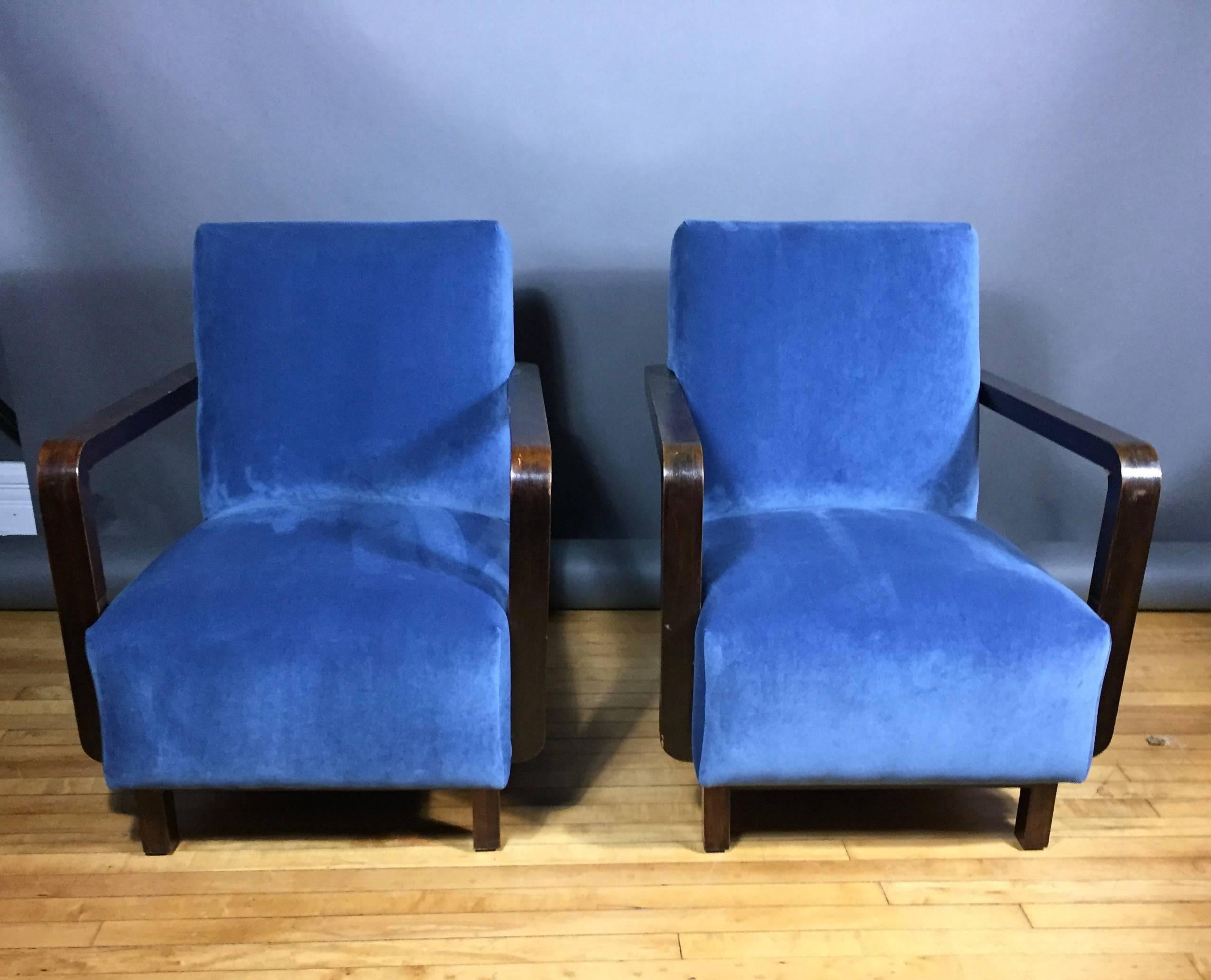 Early 1940s Danish design with original spring'd seat and seat back of solid construction. Architecturally pleasing square-arm of dark stained beech. New navy velvet upholstery. Handsome and built to last.