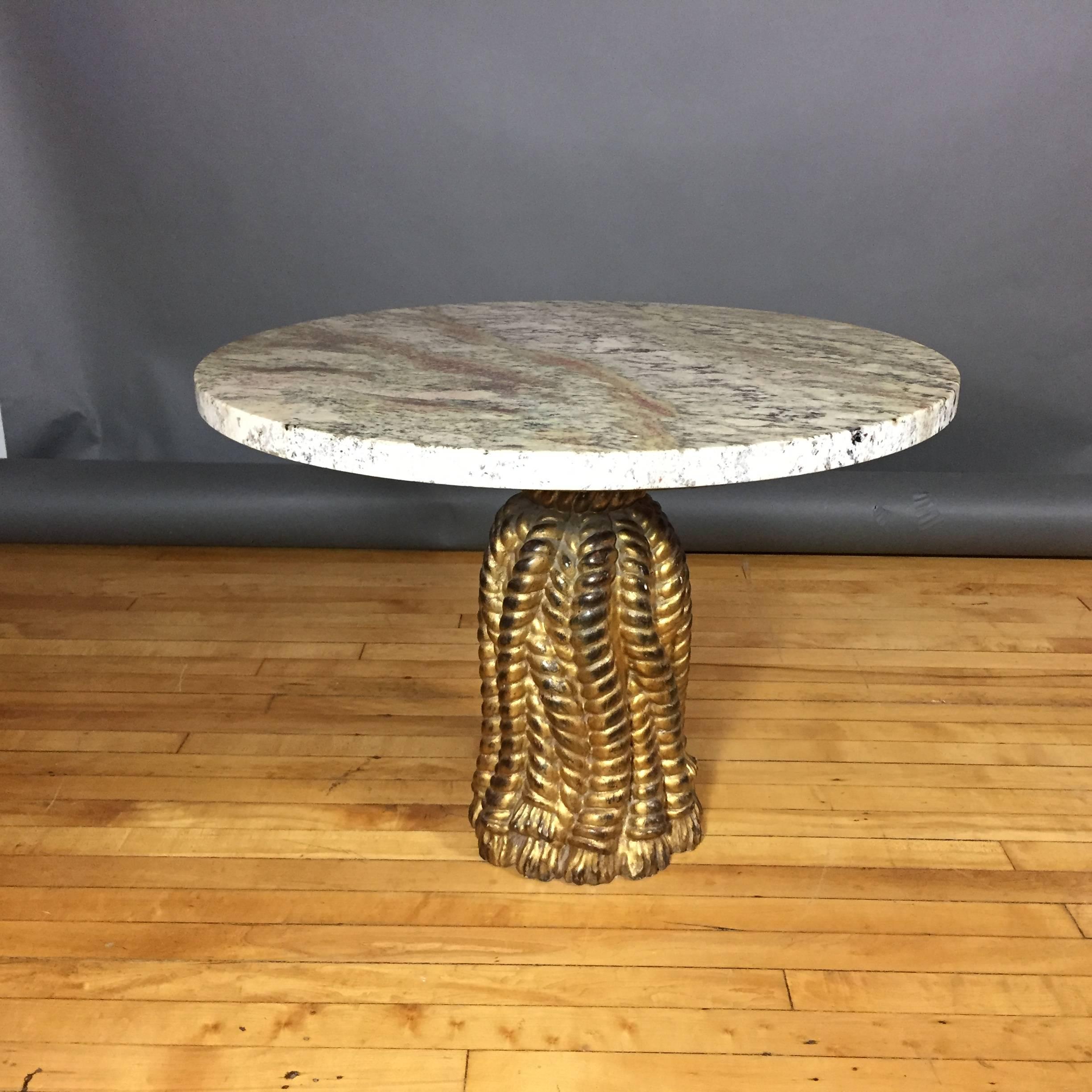 Elegant and humorous, this 1950s, Italian coffee table has a hand-carved and gilt base in the shape of a series of large gathered rope tassels. Original marble base recently replaced with gorgeous new Italian marble.