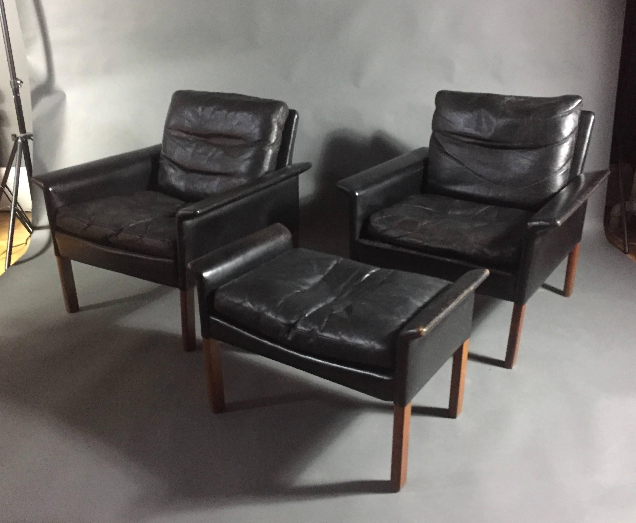 Perfect Scandinavian design by Hans Olsen with flared armrests - in wonderfully vintage black leather and solid rosewood legs. Loose seat cushions are down filled for comfort. Made by C.S. Mobler, Glostrup Denmark in the mid-1960s. Includes lne