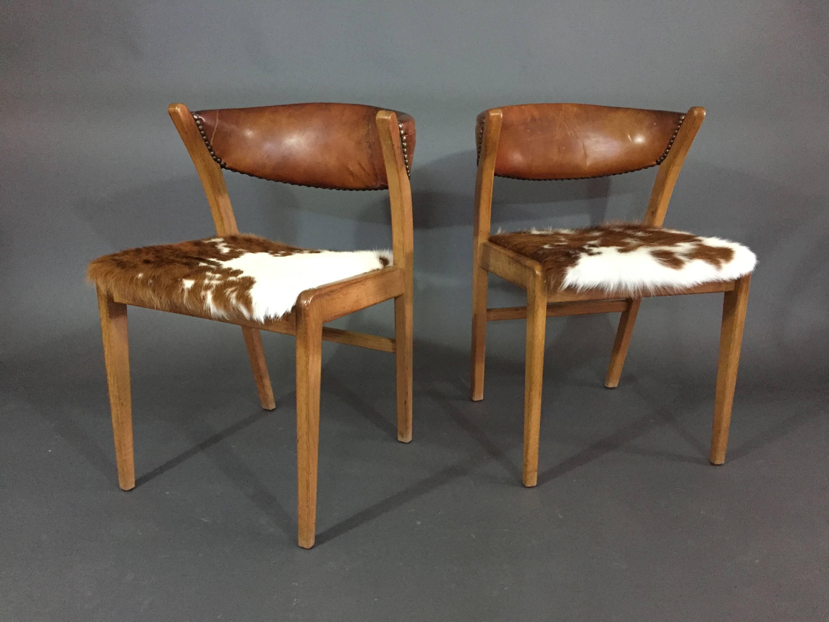 Scandinavian Modern Four Danish 1960s Oak, Leather and Cowhide Dining Chairs