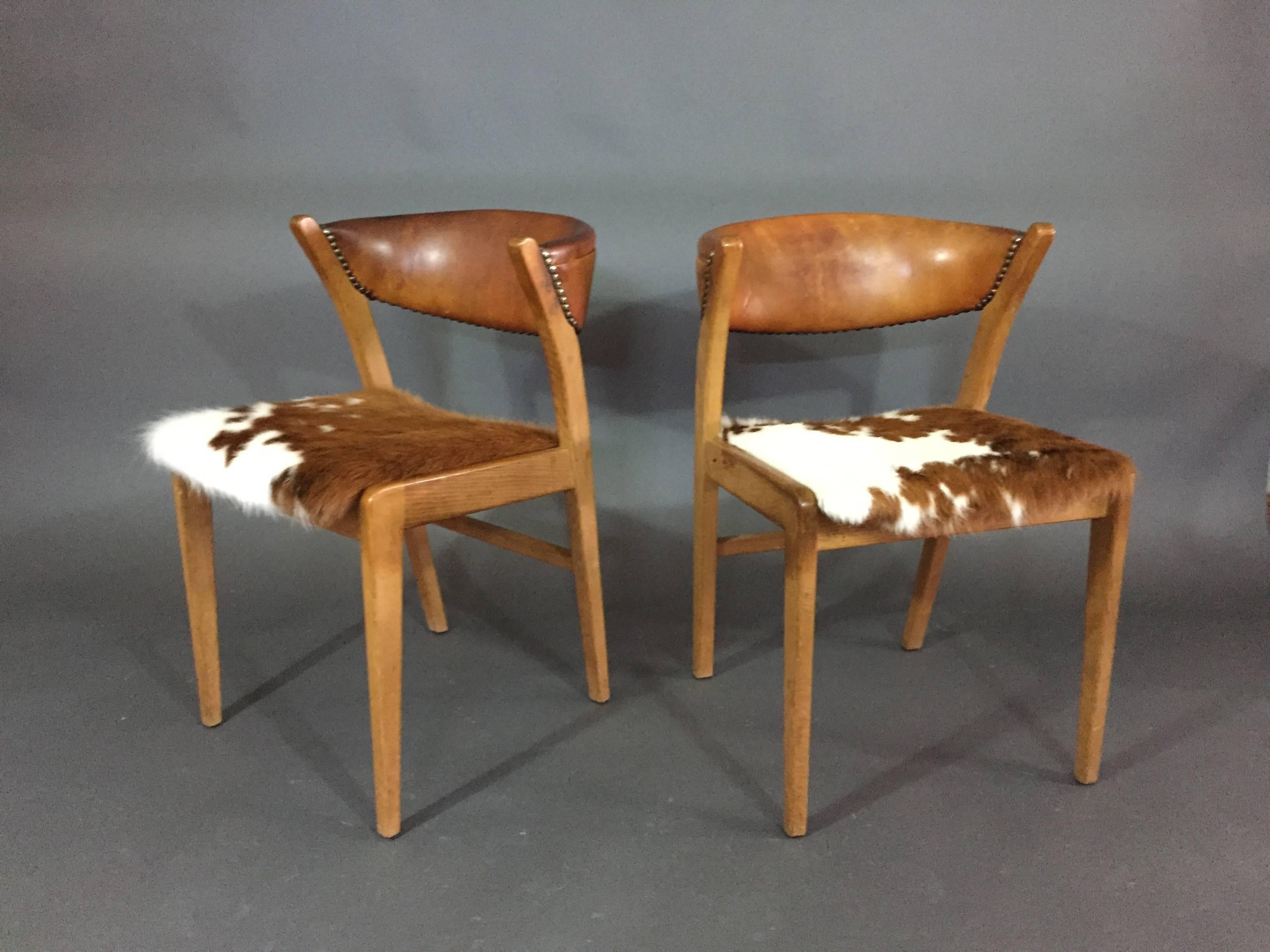 Four Danish 1960s Oak, Leather and Cowhide Dining Chairs In Good Condition In Hudson, NY