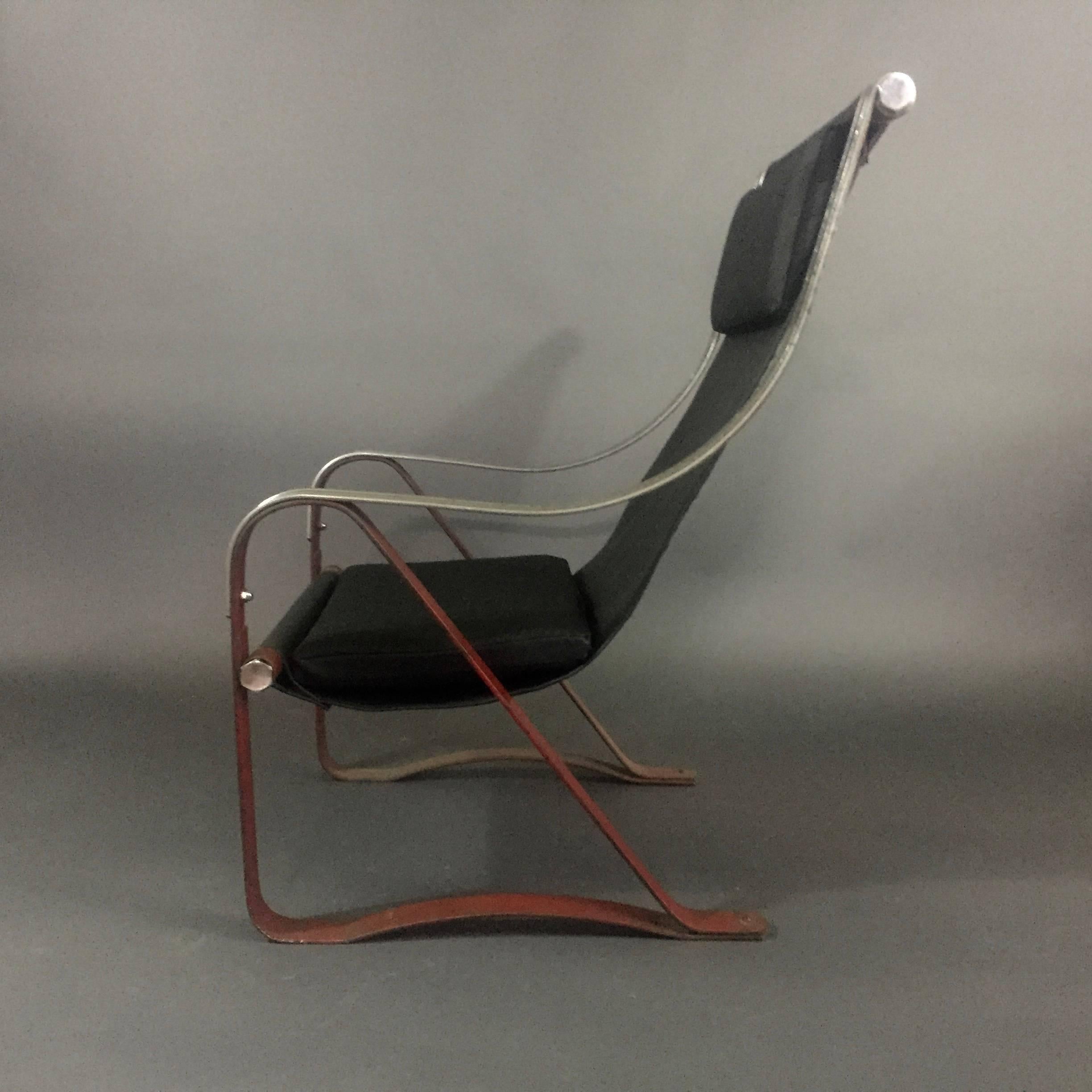 John McKay designed this sling lounge chair for the 1933 World’s Fair in Chicago Hall of Science - highlighting the new Machine Age furniture with chromium-plated steel. This sling chair version has original painted green line on arms and red
