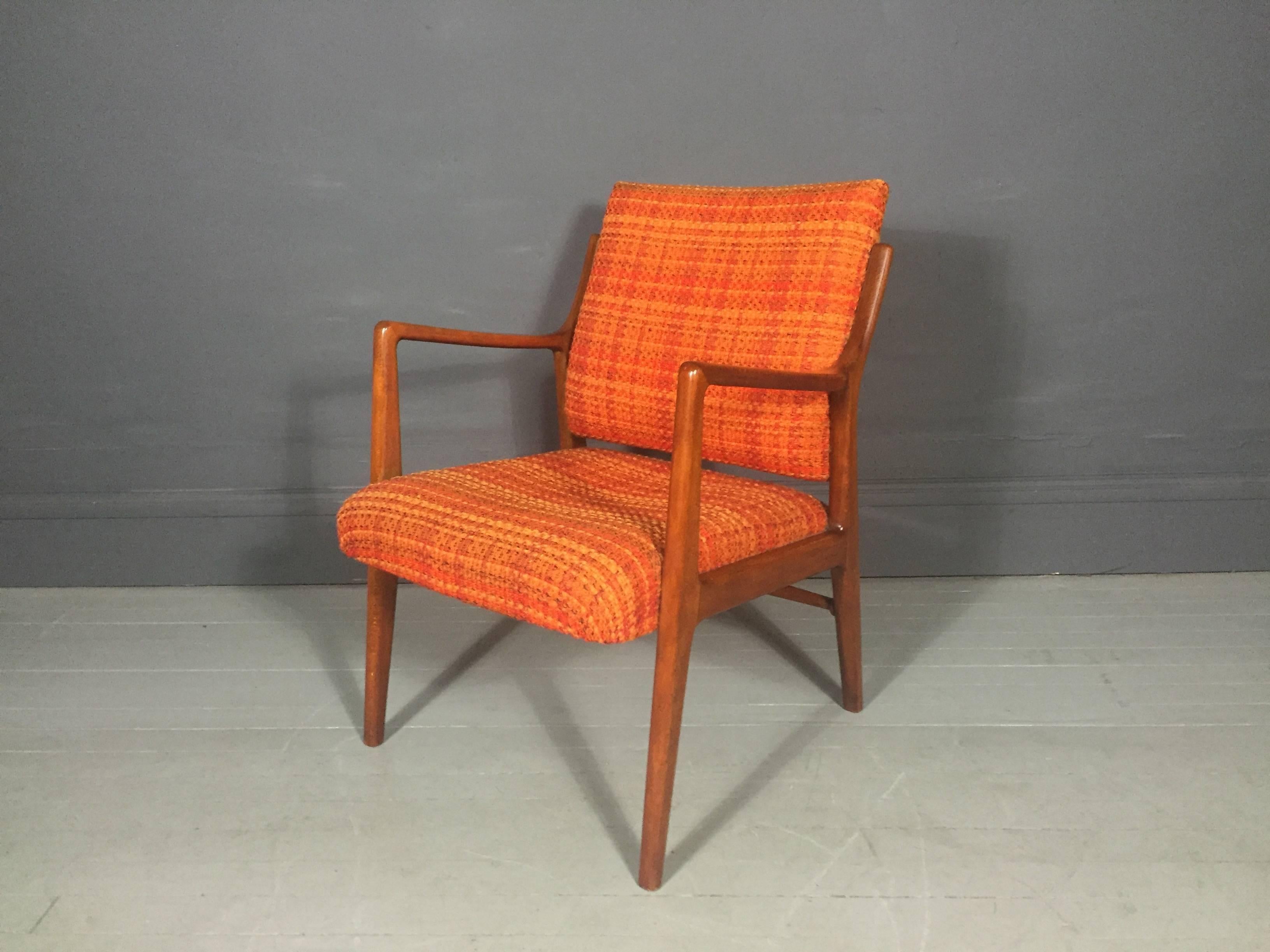 A Classic Mid-Century Scandinavian design armchair with an amazing newer bright woven wool upholstery in shades of orange, teakwood frame, 1950s.

Excellent condition.