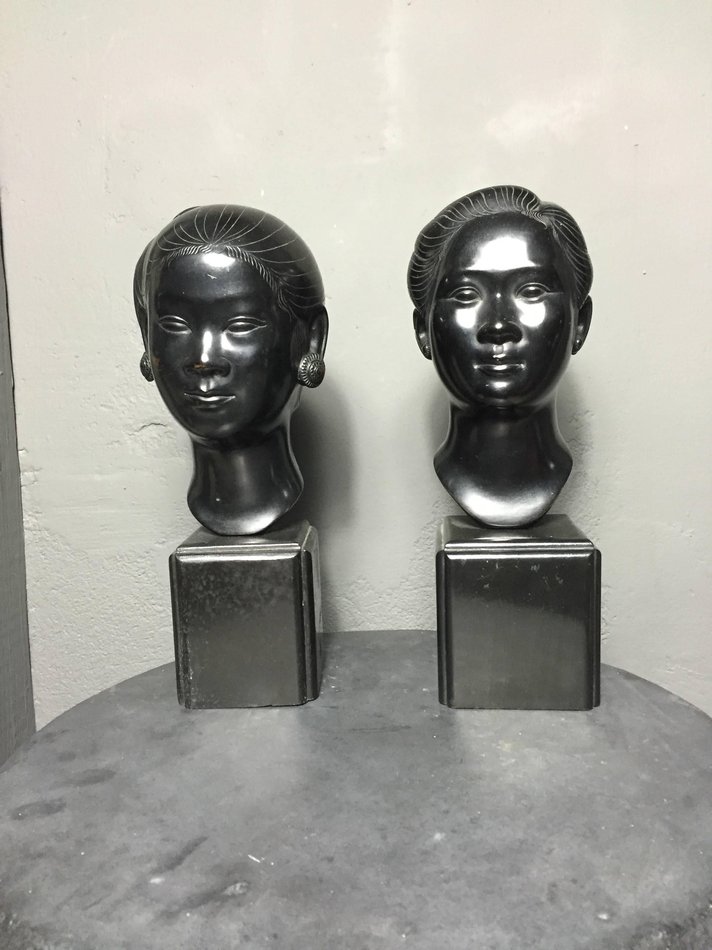 Exquisite pair of black-cast bronze geisha in bust form on black painted wood base, possibly Vietnamese. Mid-century. Marks on each, see images.

Base dimension: 3.25 x 3.25 inches

