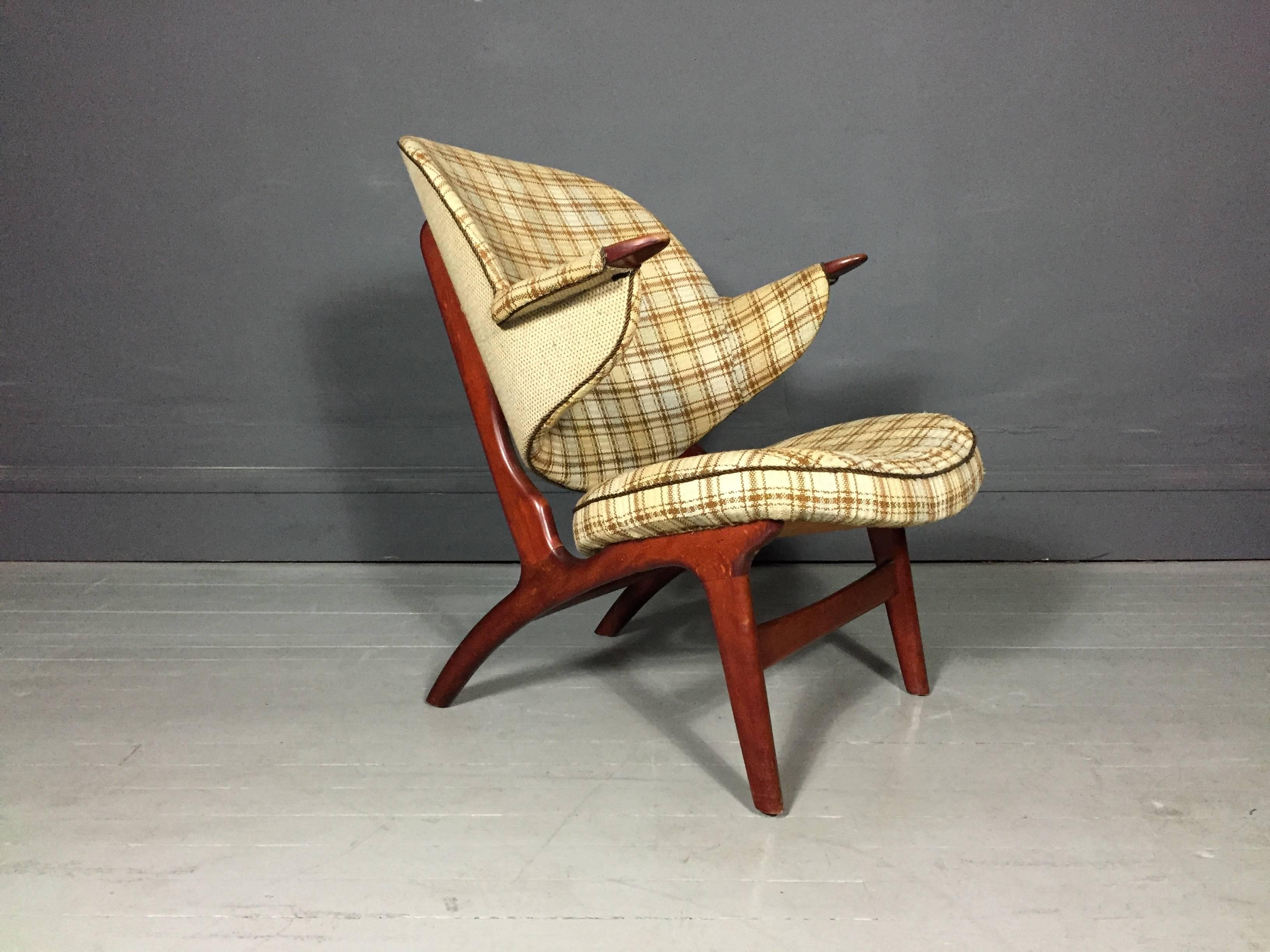 A perfect Scandinavian modern armchair with stained beech frame and vintage wool upholstery. Designed by Carl Edward Matthes in 1950s, Model 33, manufactured by Matthes polstermøbelfabrik.

Light wear to seat edge and slight coloration change at