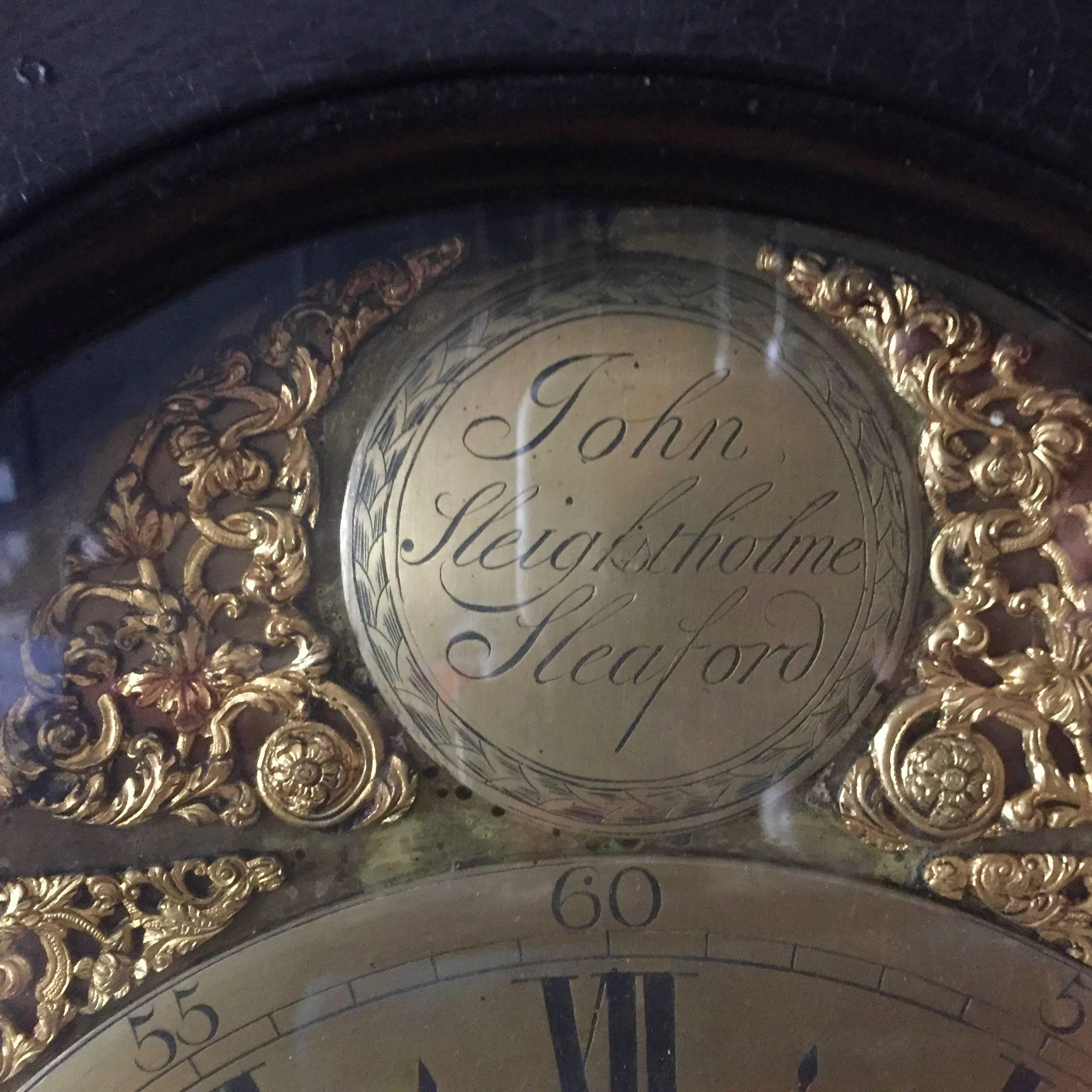 Mid-18th Century English Black Polished Ornately Carved Tall Case Clock In Good Condition In Hudson, NY