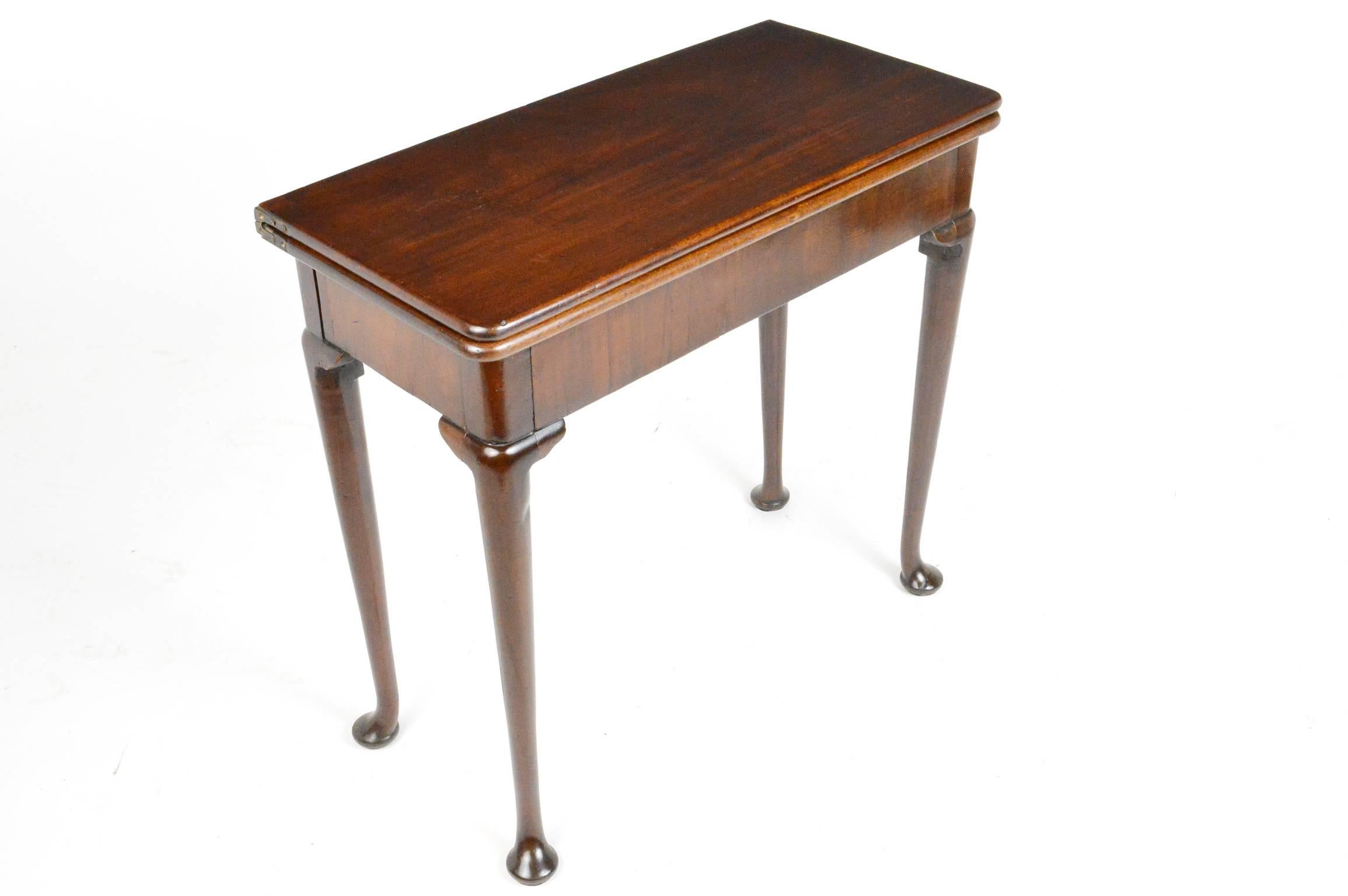 18th century English mahogany game table with cabriole legs having a warm patina to finish and a beautiful grain.