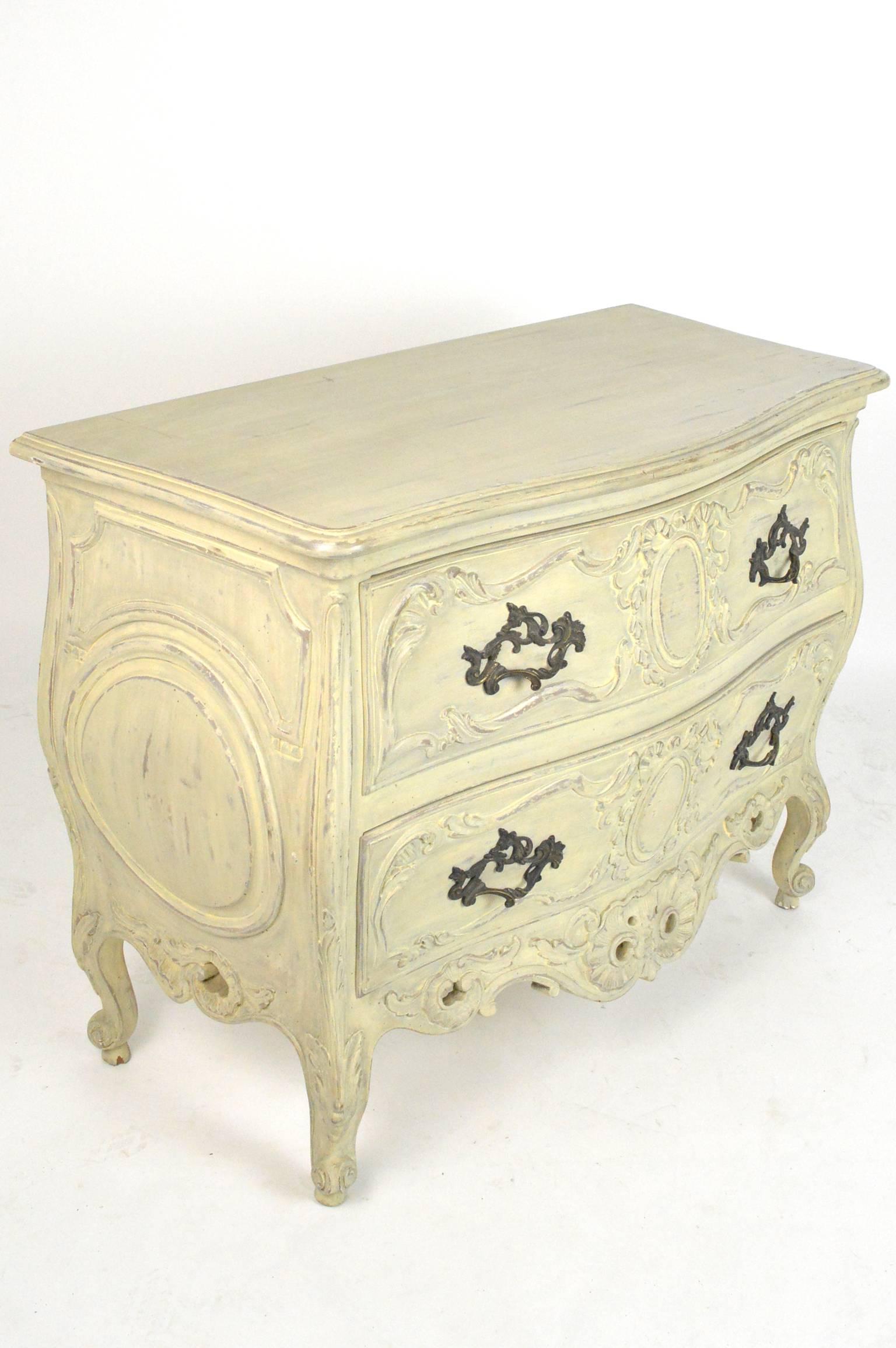 Painted bombe commode with two drawers having a painted finish with bronze hardware. Mid-20th century.
Provenance: Richard Himmel, Palm Beach, FL.