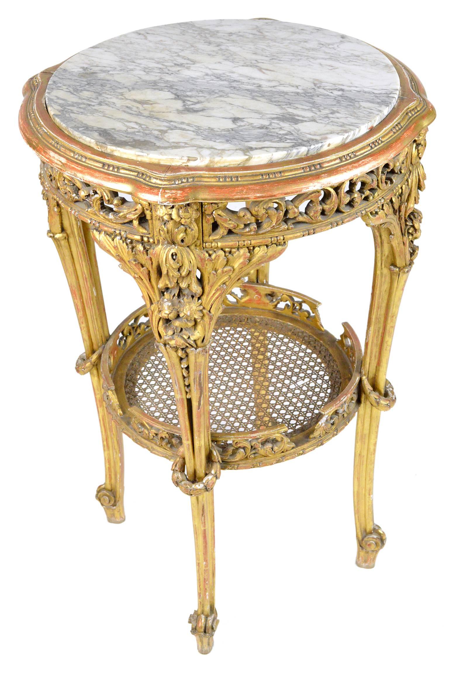 Late 19th, early 20th century French Baroque style giltwood marble-top table.