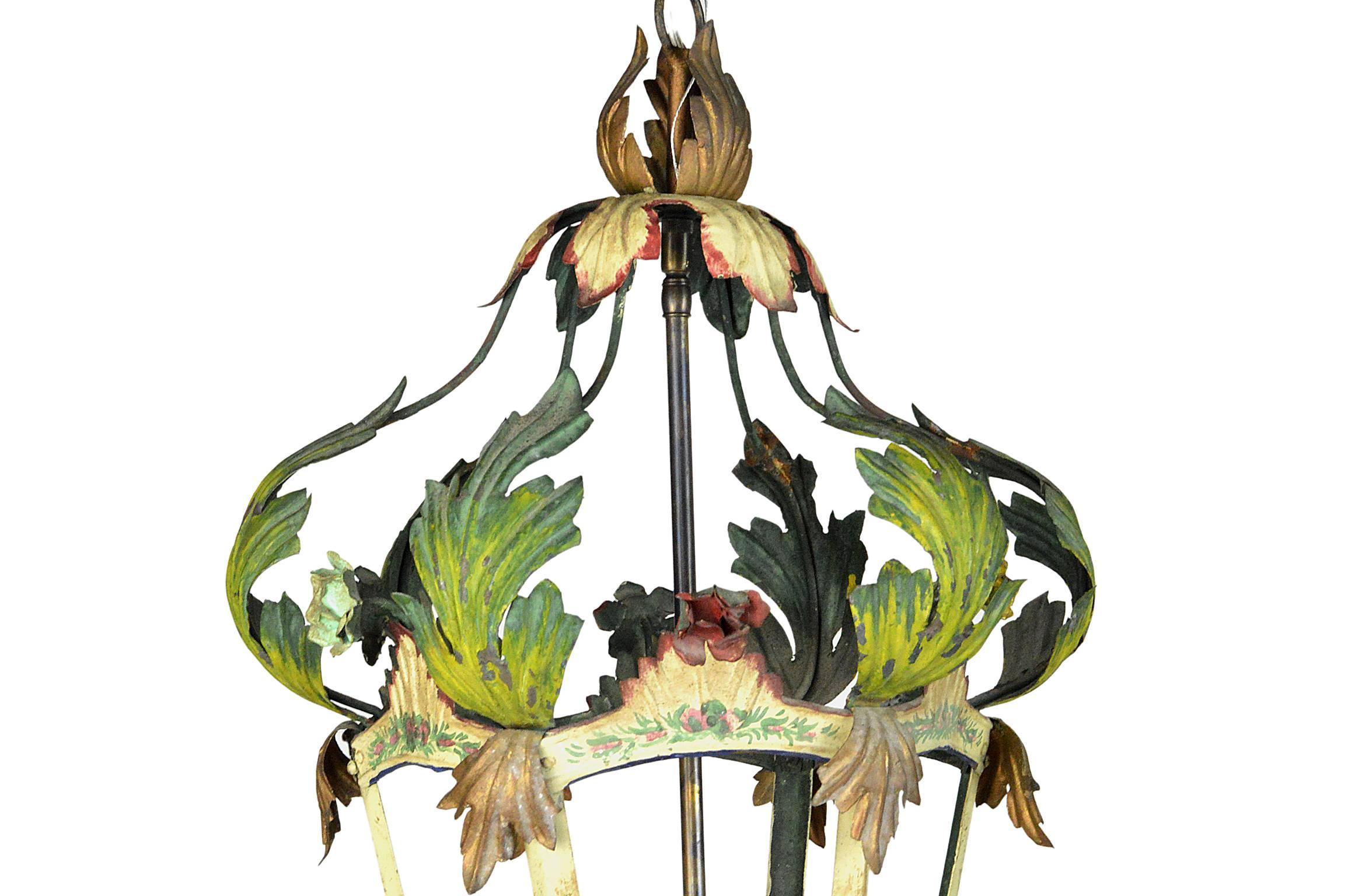 Italian tole painted three-light lantern with polychrome painted decoration throughout. Newly rewired for USA specifications and ready to hang.