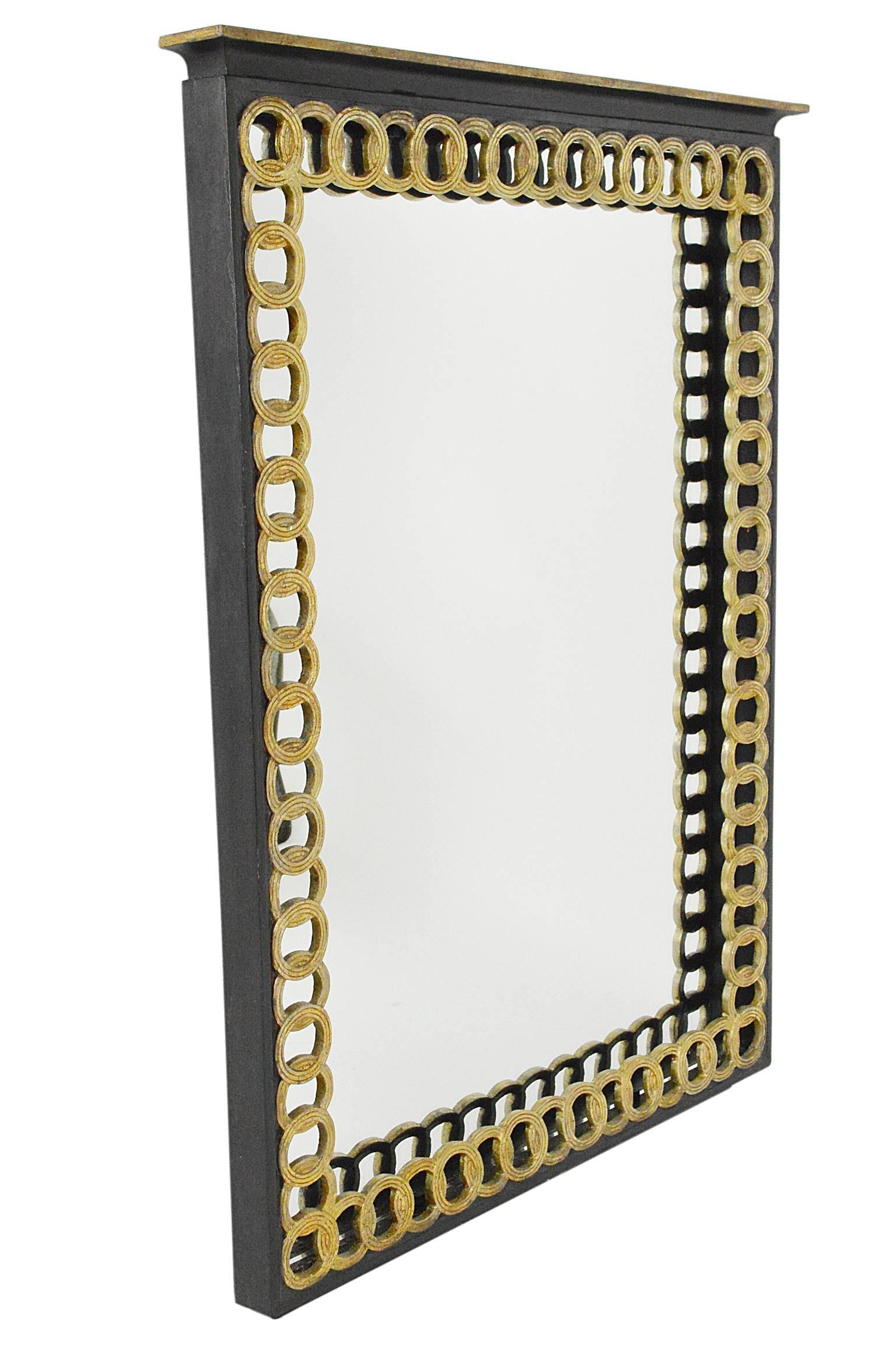 Hollywood Regency style mirror with chain link motif.