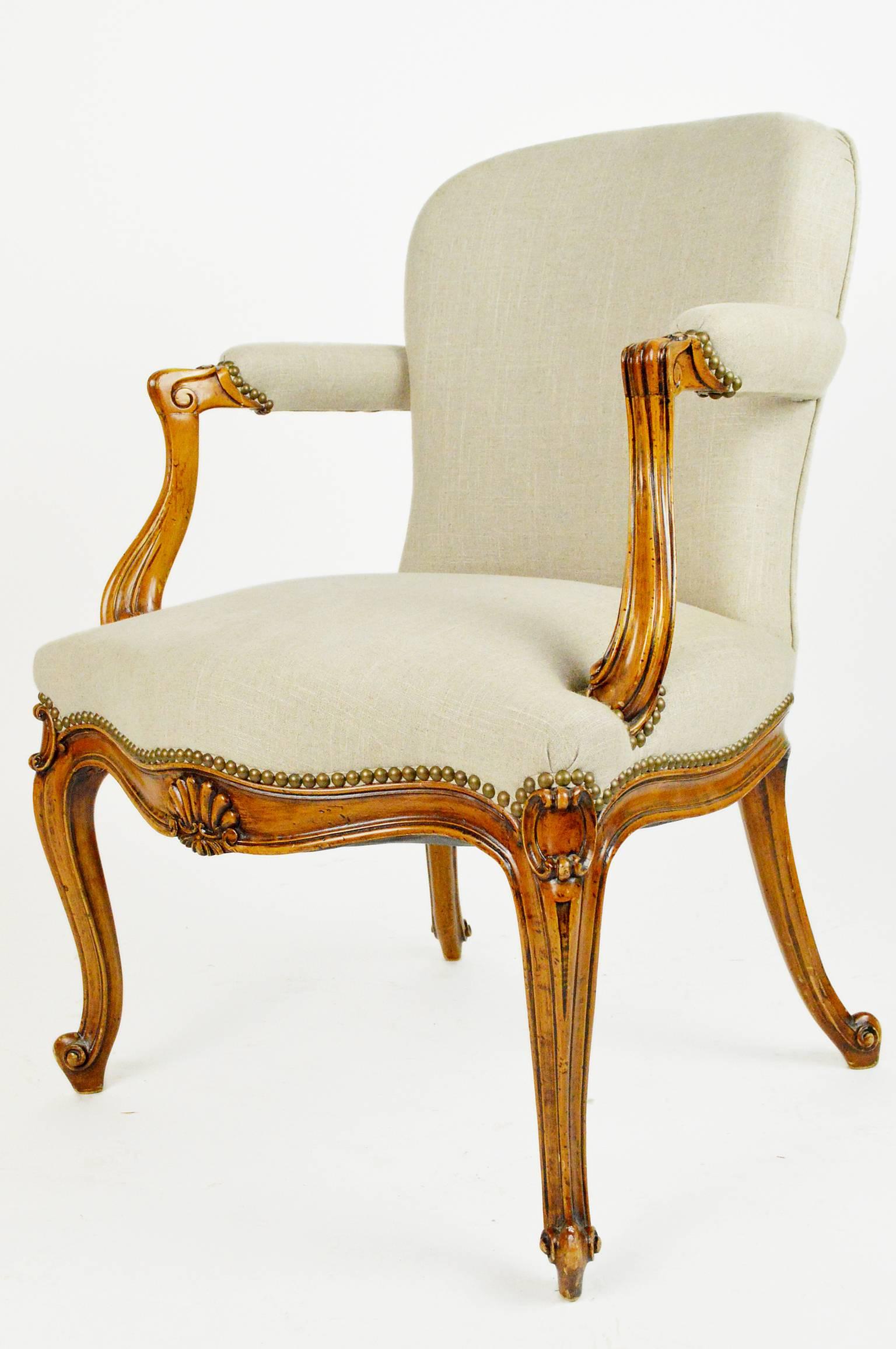 Late 19th century French Regency style carved wood open armchair.
Measures: 28.25