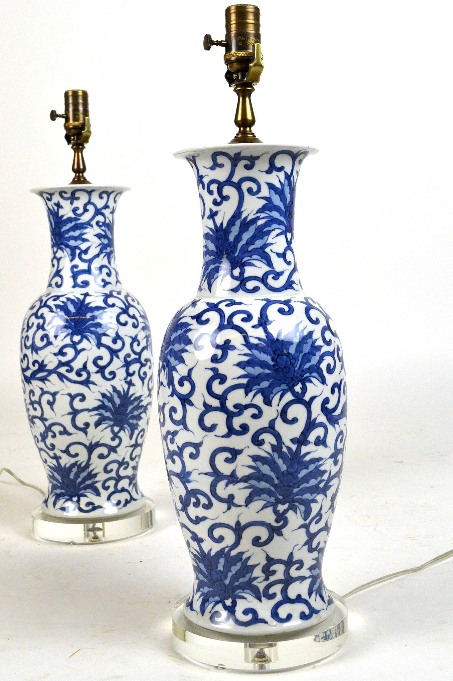 Pair of Mid-Century Japanese blue and white porcelain lamps.
Measures: 25