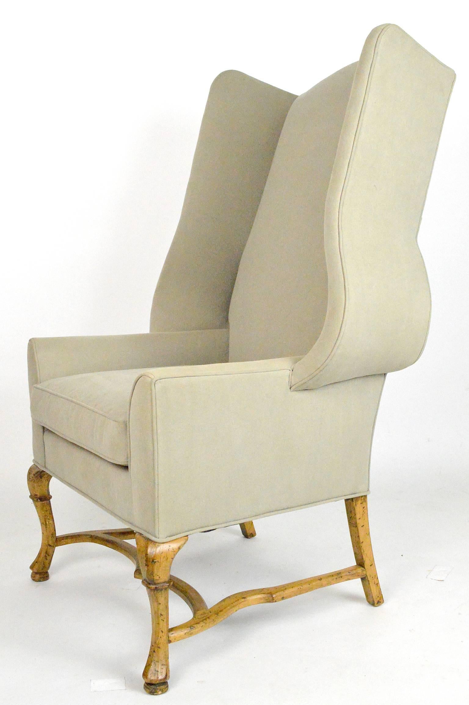Large-scale French country style wingback chair.