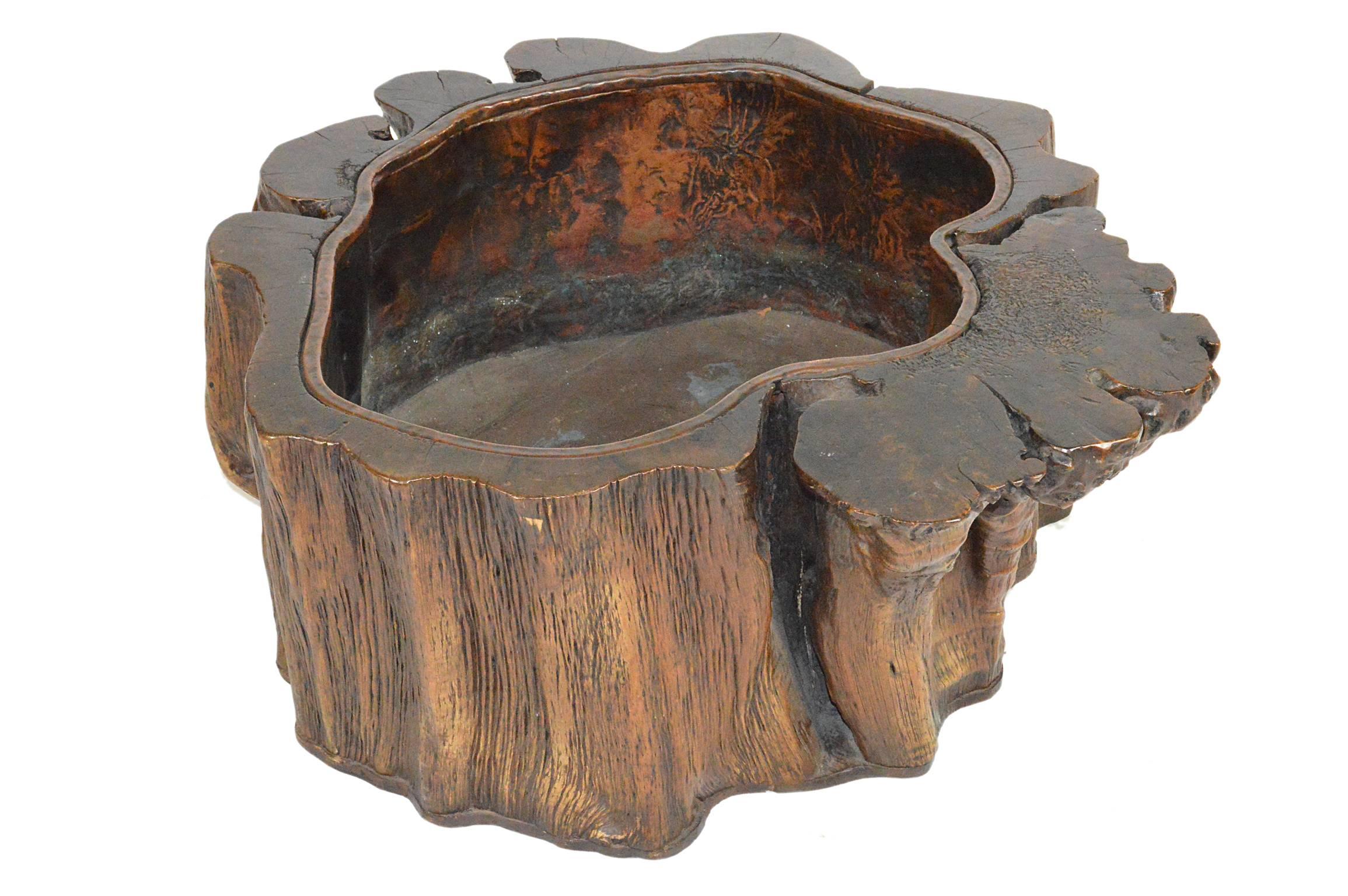 Japanese Meiji period hollowed tree trunk jardinière with a dark brown twisted trunk with a confirming copper metal liner.