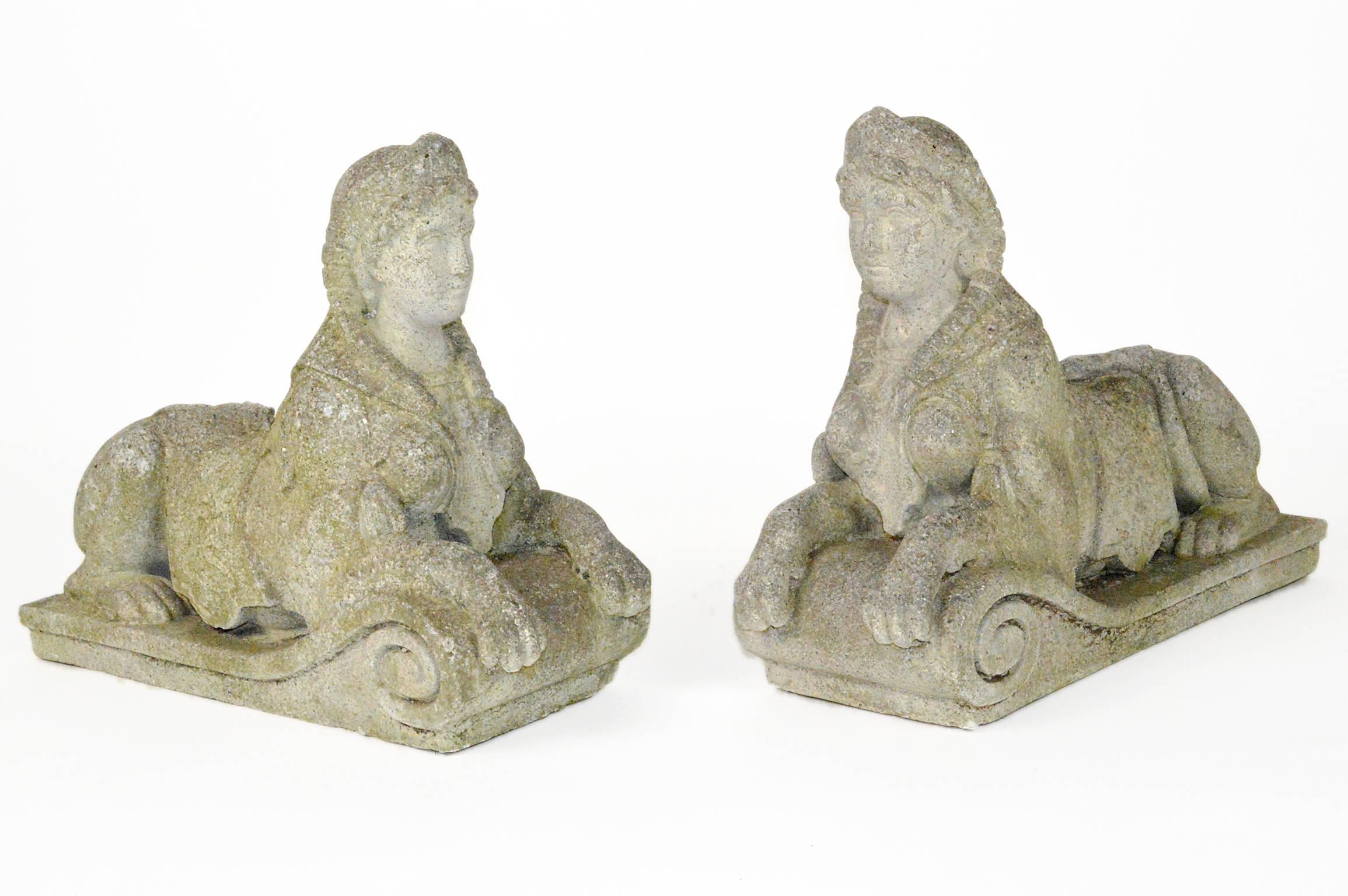Pair of Egyptian Revival finely carved stone garden sphinx with nice antique weathered finish.