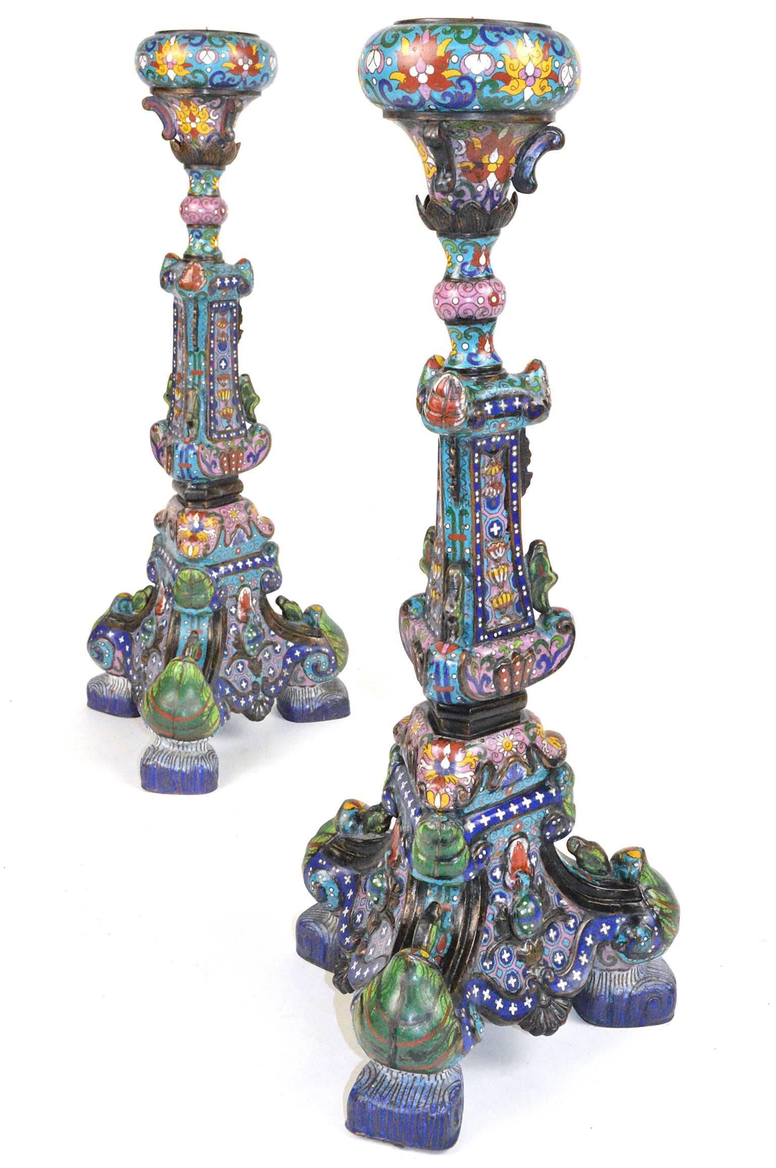 A pair of Chinese cloisonné candlesticks. Handcrafted and decorated with aqua blue background, intricate patterns and multicolored enameled details. Can be wired as table lamps. 