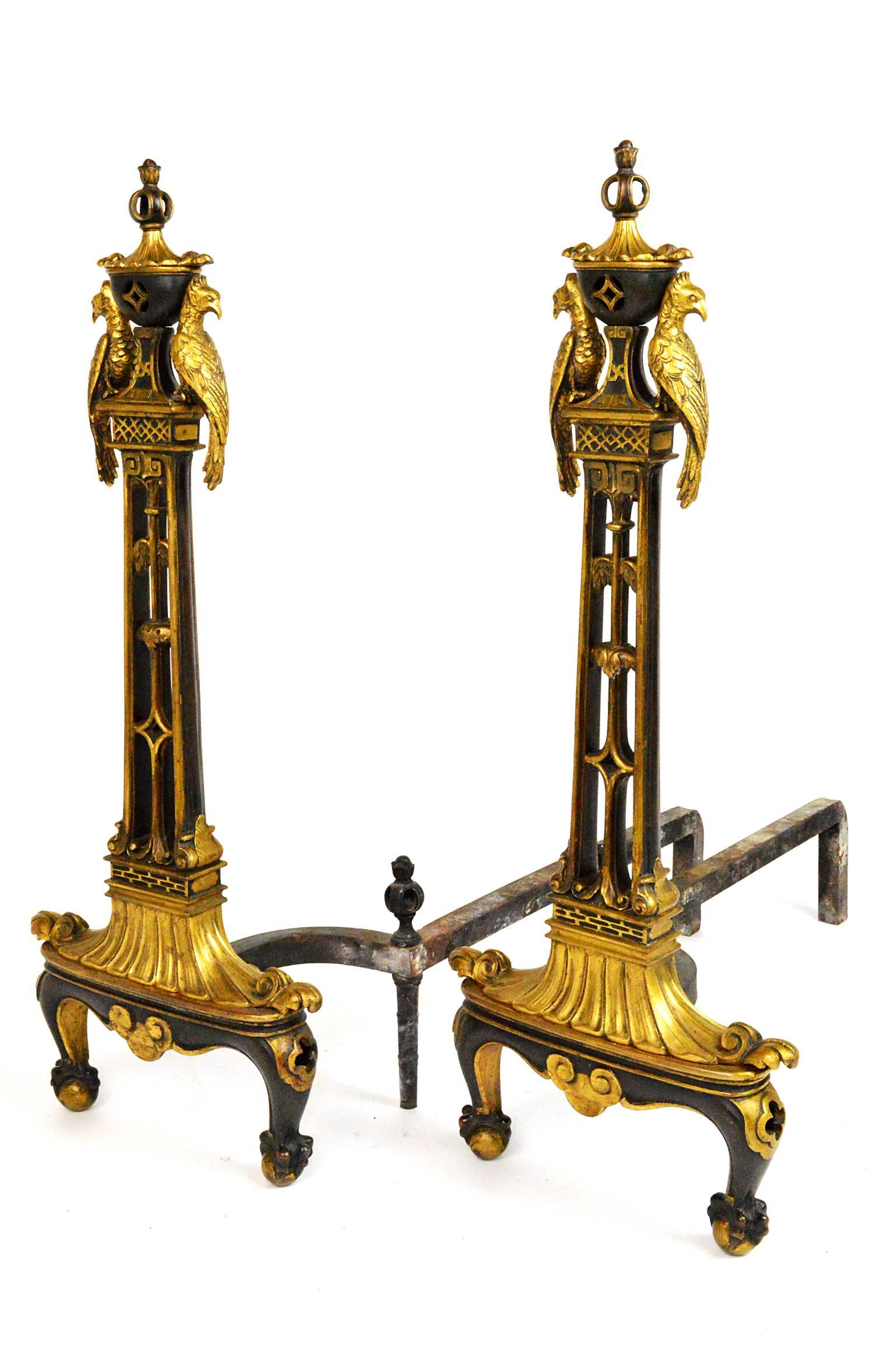 Pair of Chinese Chippendale style gilt and patinated bronze andirons. Featuring figural exotic birds, reticulated uprights and ending in ball-and-claw feet. Likely E F Caldwell New York.