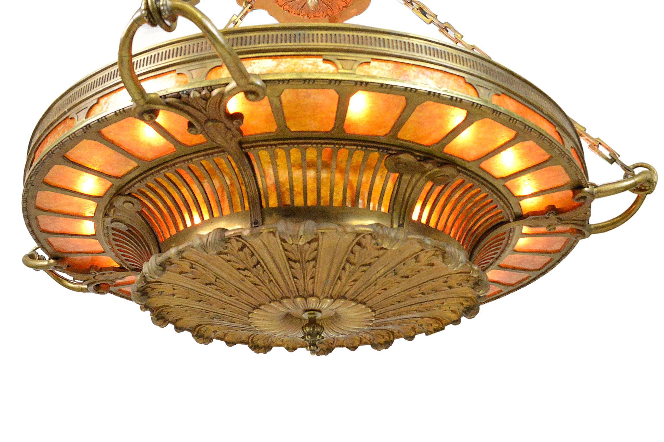 Monumental neoclassical style bronze and mica chandelier by Mitchell Vance, New York, circa 1910. Beautiful original patina throughout, newly rewired. Established in 1854, the Mitchell Vance Company was an industry leader in early 20th century