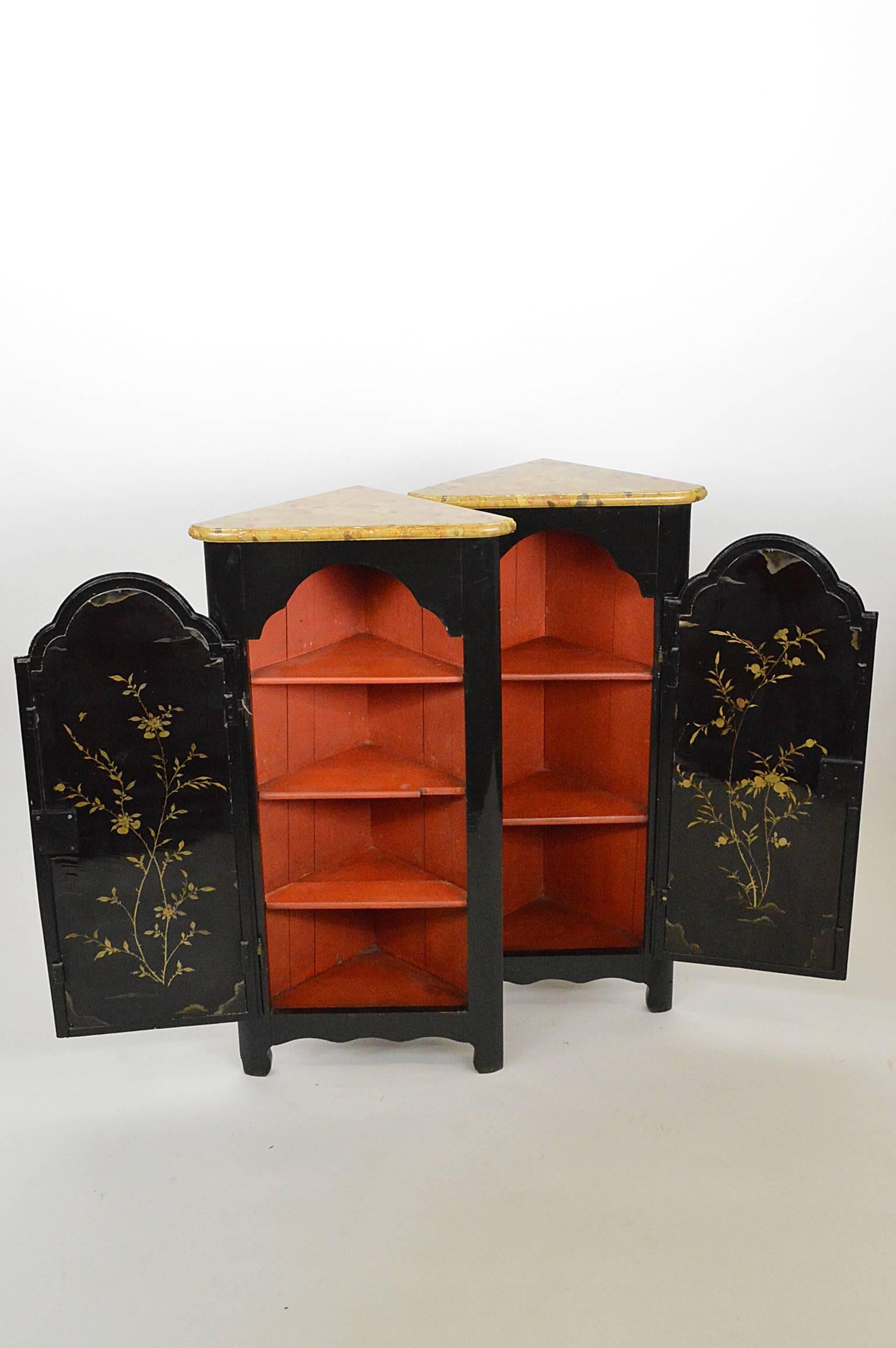 Pair of 19th century English chinoiserie corner cabinets with faux siena marble tops.