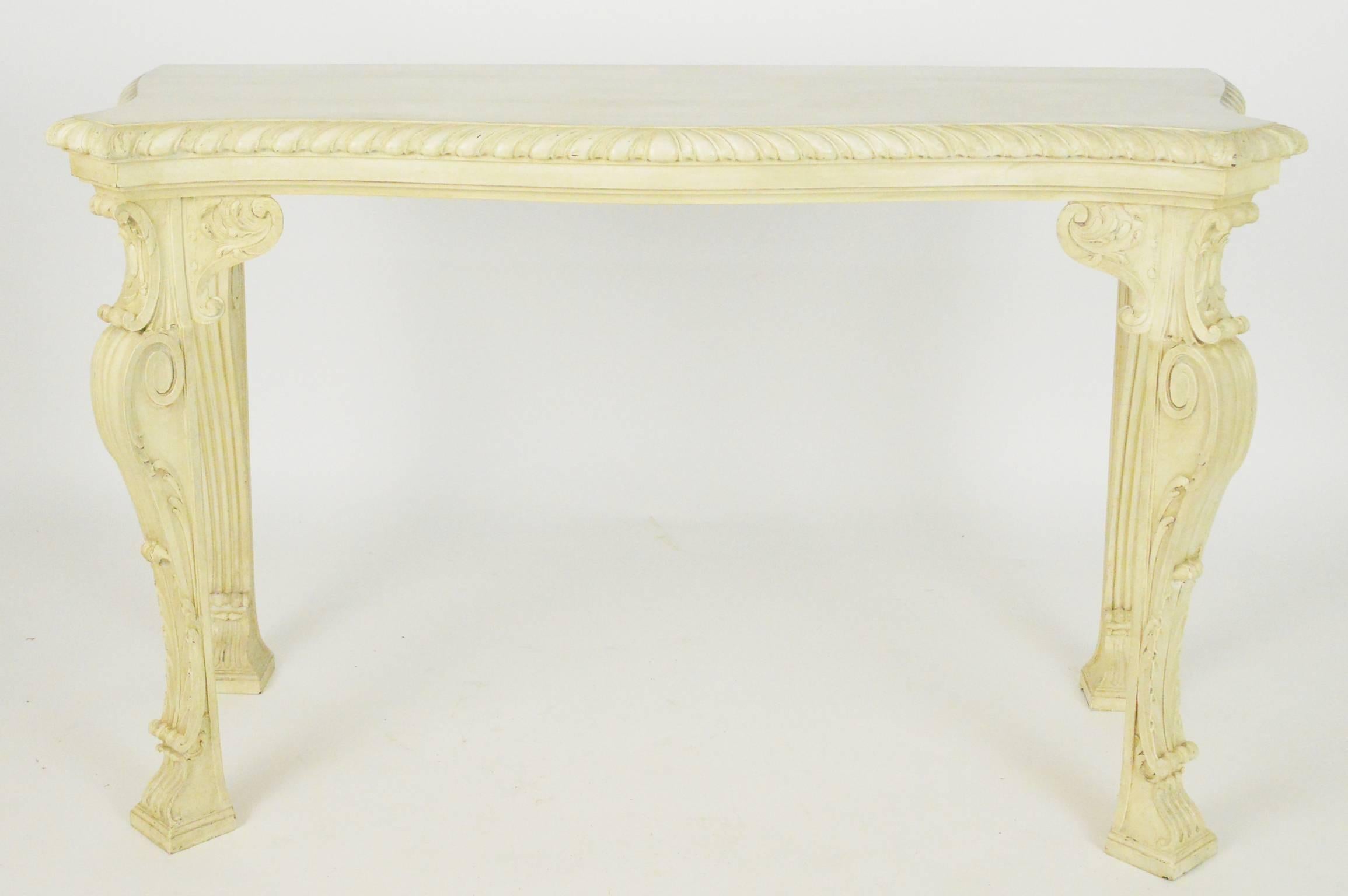Pair of beautifully carved English George II William Kent style console tables.